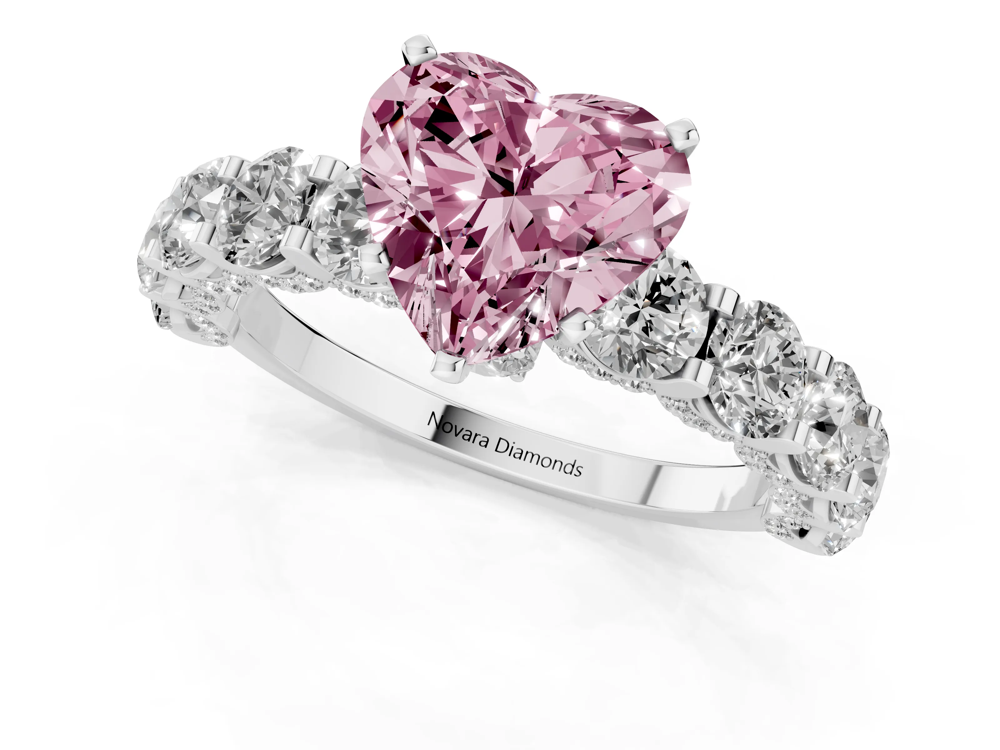 Fancy Pink Heart Cut Diamond Side Stone Ring Set in White gold with Alternating Round and Oval Side Stones