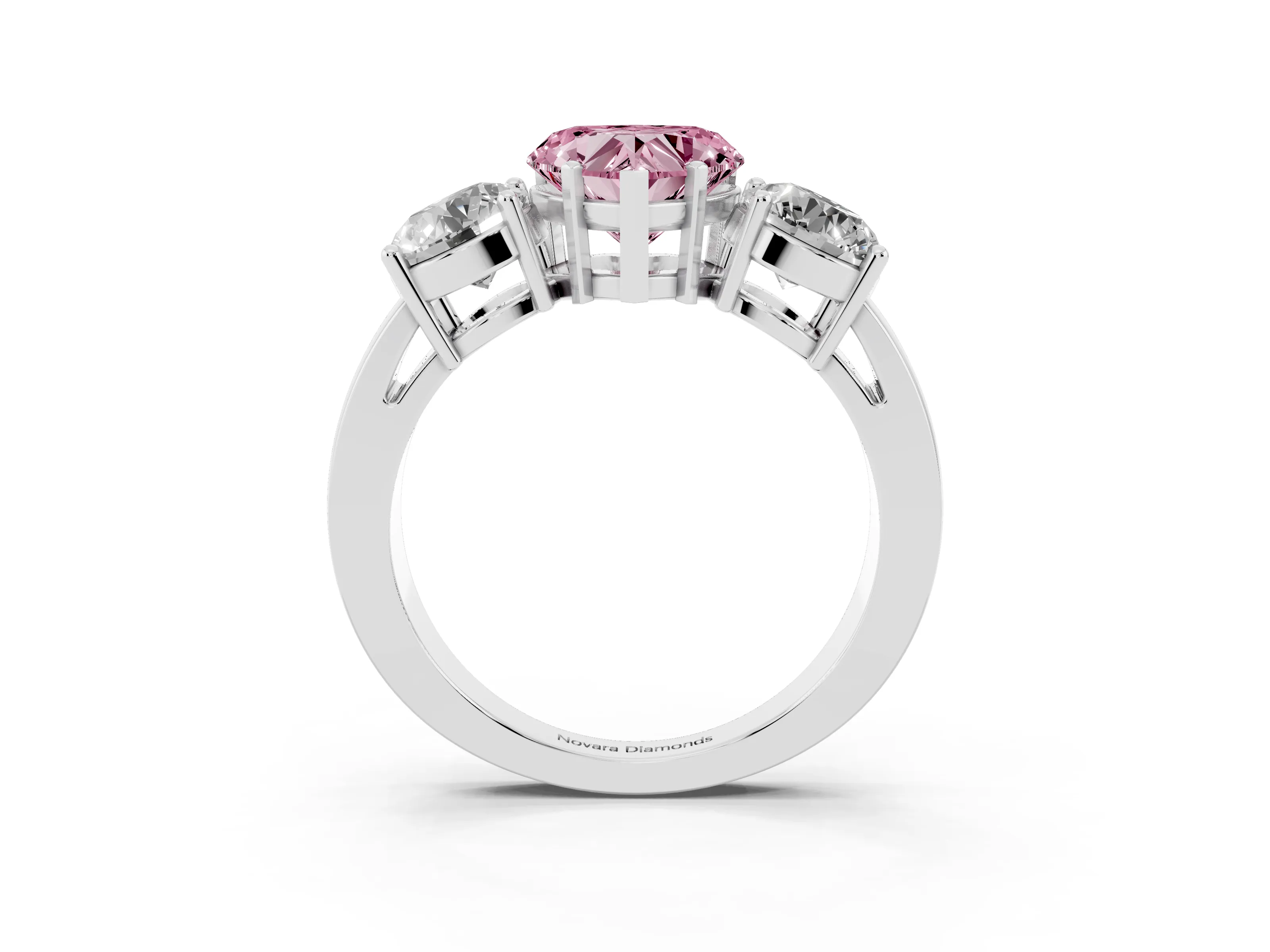 Fancy Pink Heart Cut Diamond Three-Stone Ring Set in Platinum with Round Side Stones and Classic Band