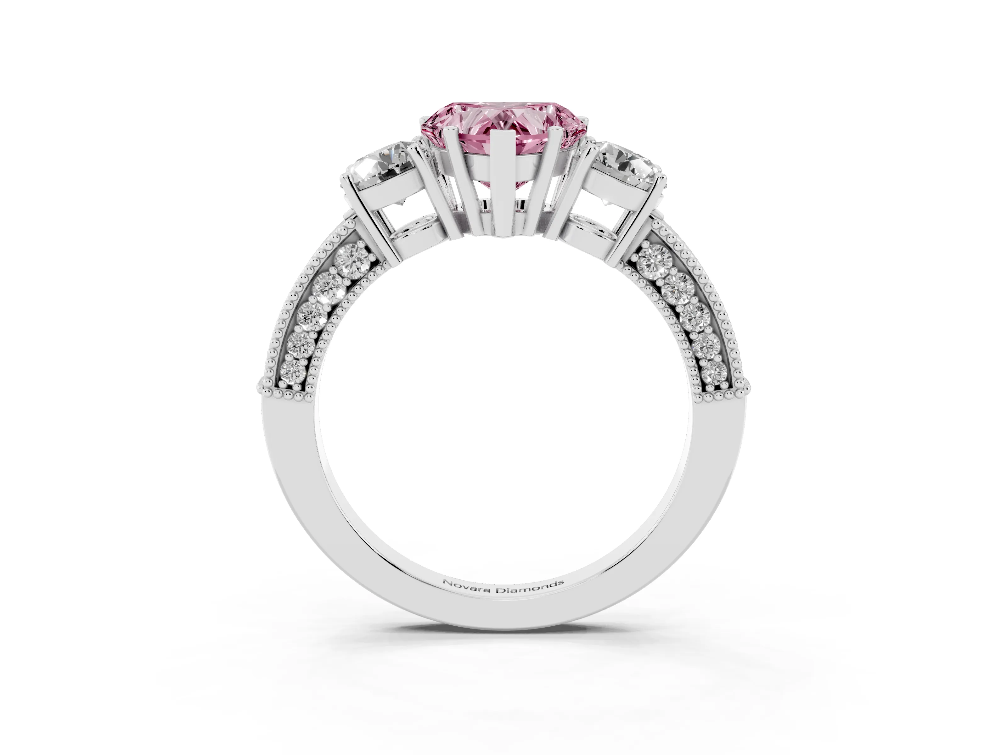Fancy Pink Heart Cut Diamond Three-Stone Ring Set in White gold with Round Side Stones and Pavé Band