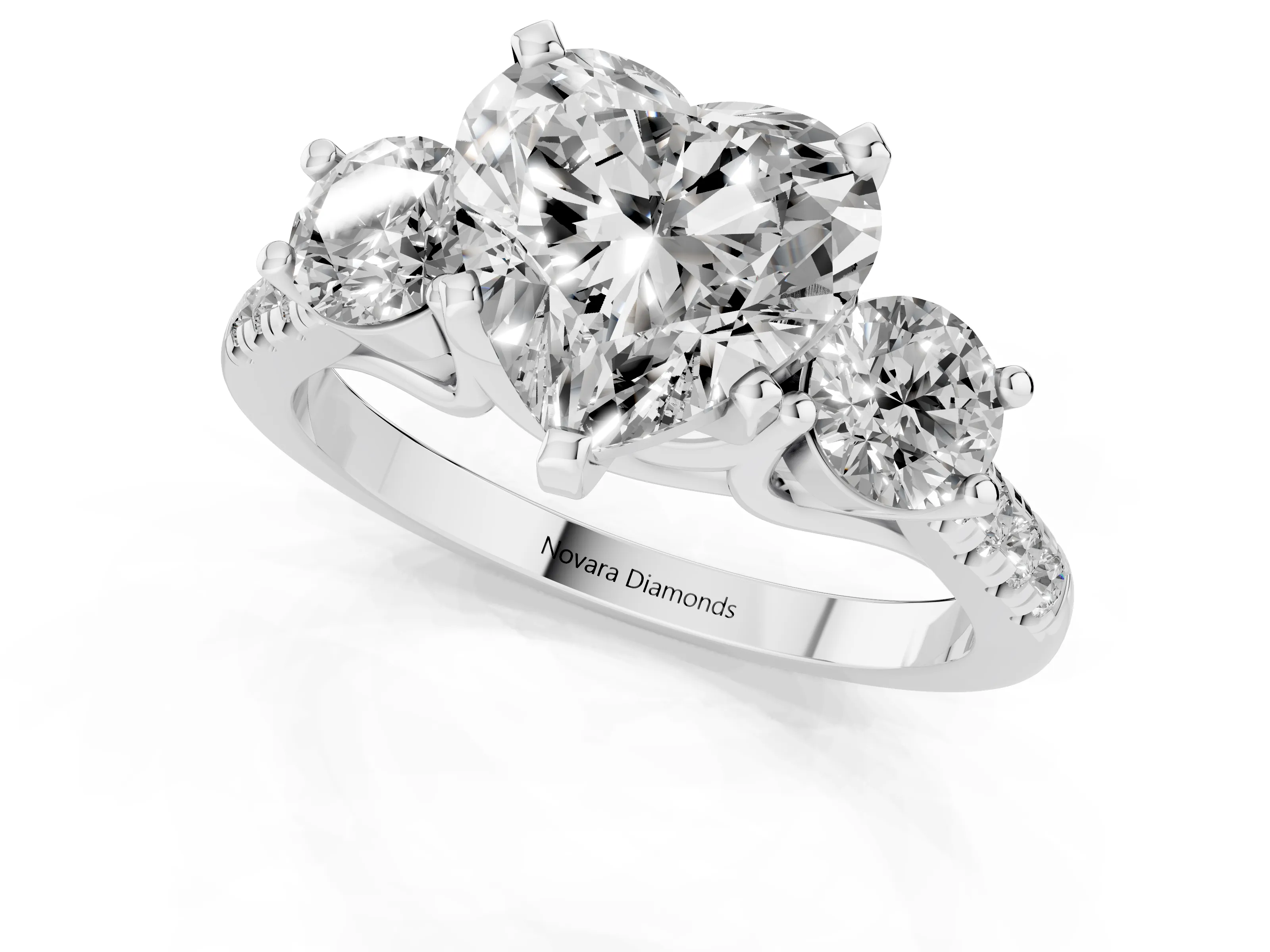 Three-Stone Heart Cut Diamond Pavé Band Ring Set in Platinum with Prong-Set Trio