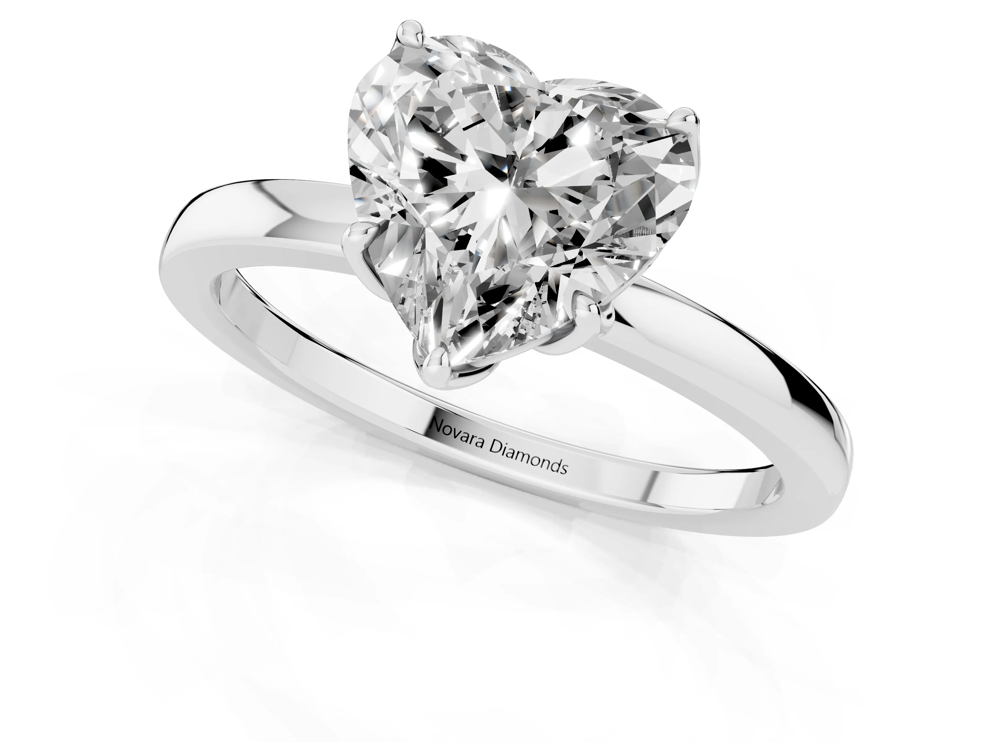 Heart Cut Diamond Solitaire Ring Set in White gold with Prong Setting and Thin Polished Band