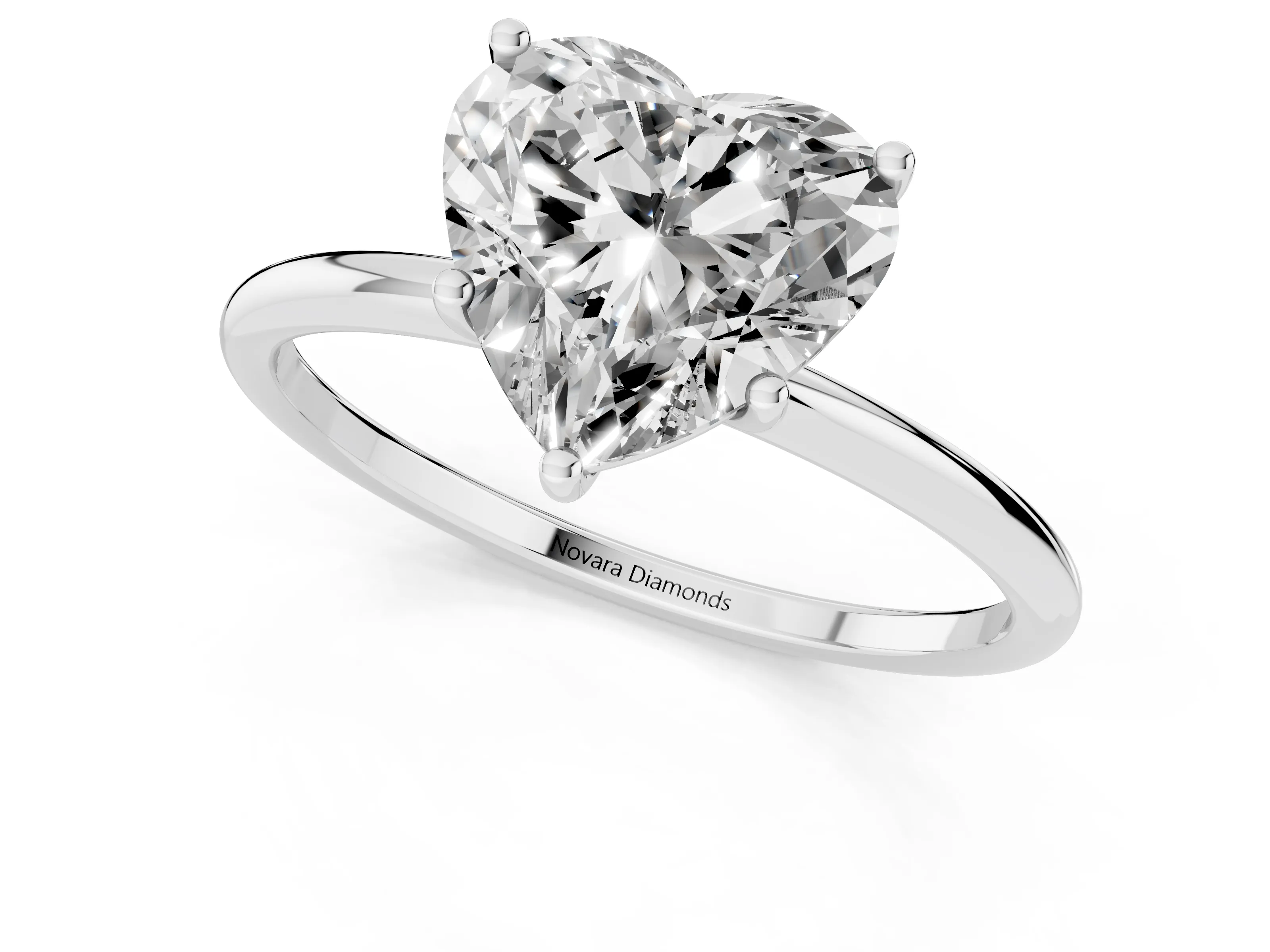 Heart Cut Diamond Solitaire Engagement Ring Set in Platinum with Thin Band and Prong Setting