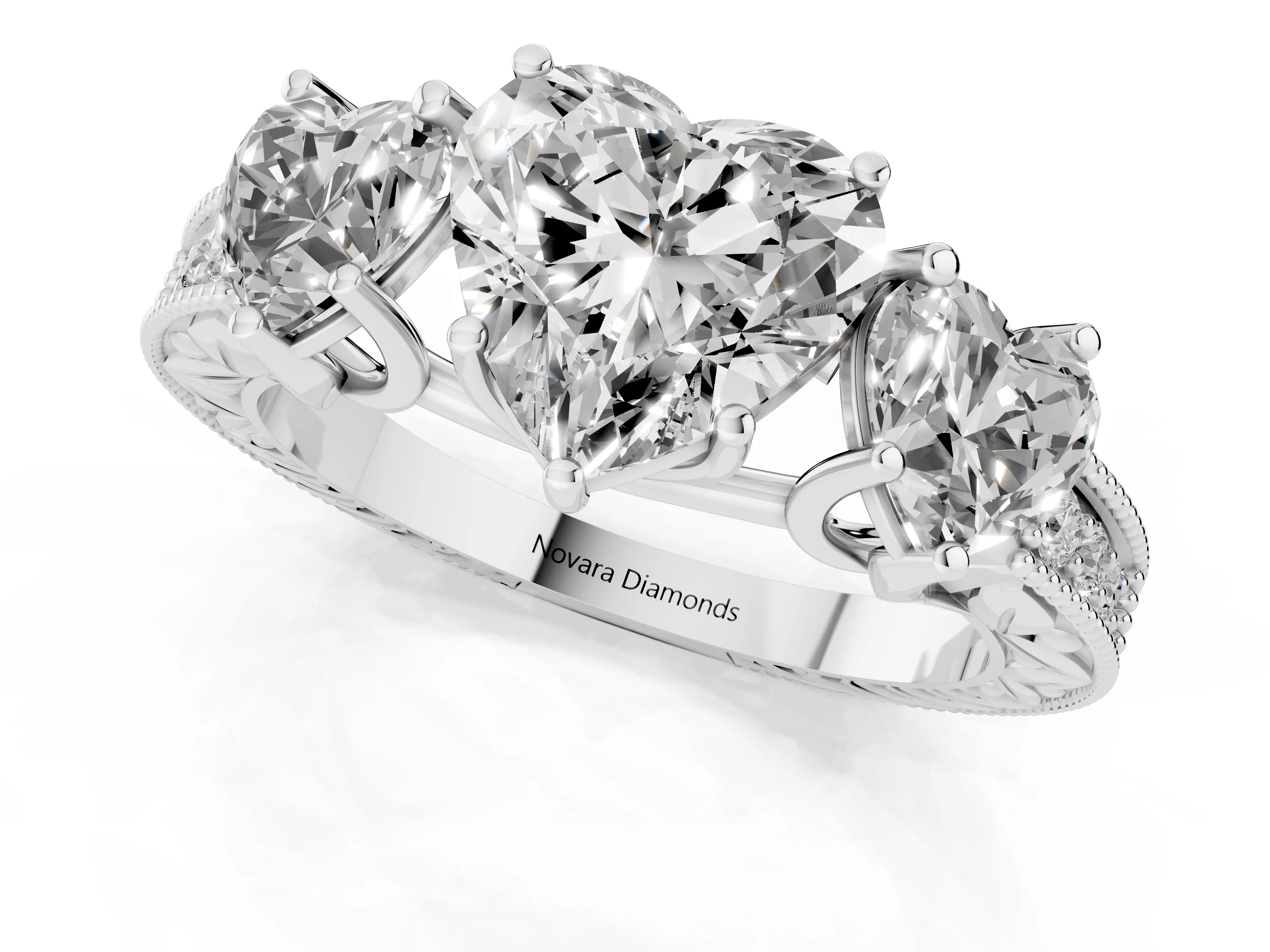 Heart Cut Diamond Three-Stone Engagement Ring Set in Platinum with Milgrain Pavé Band