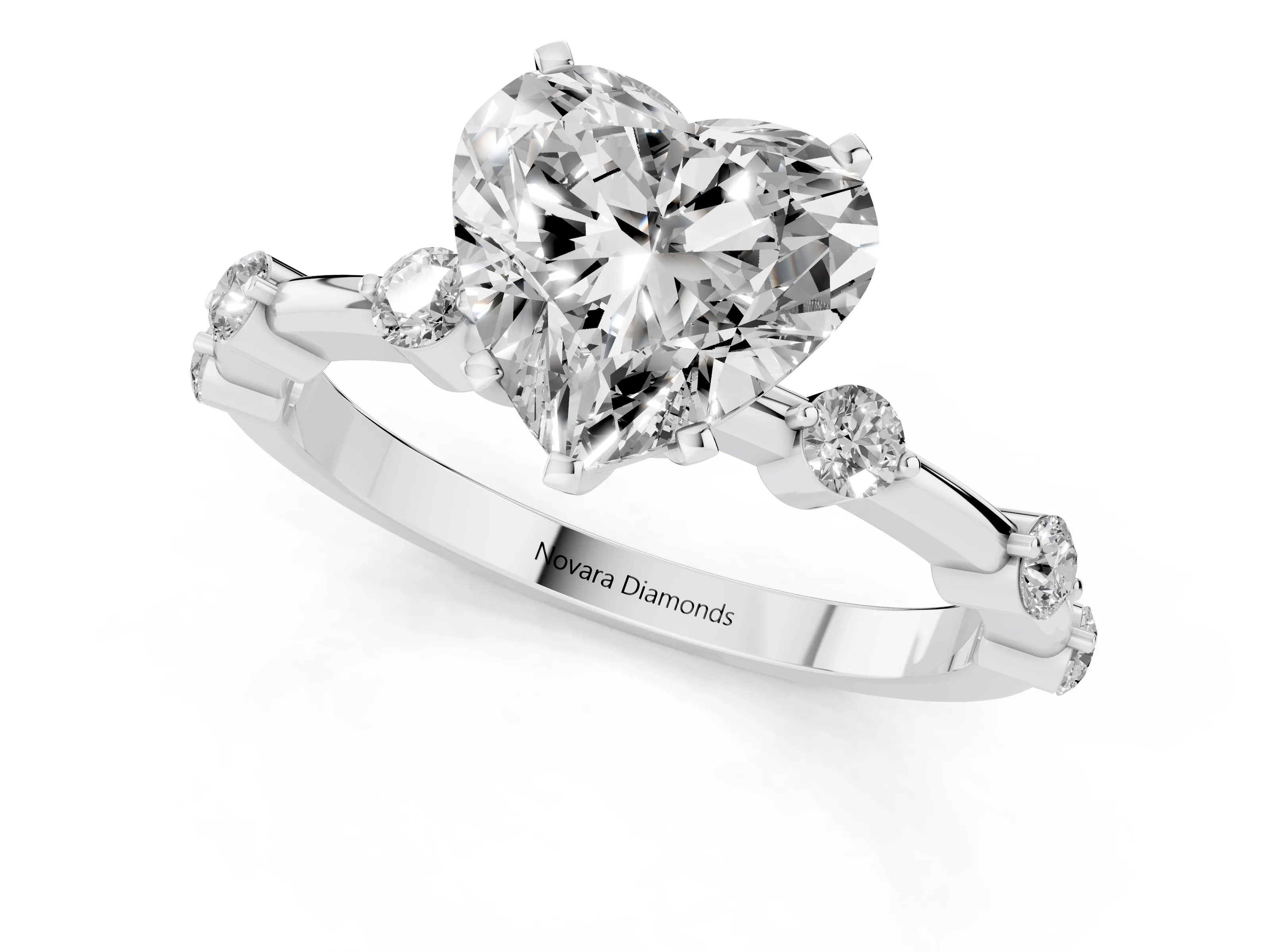 Heart Cut Diamond Solitaire Ring Set in White gold with Bezel Set Side Stones and Prong Setting