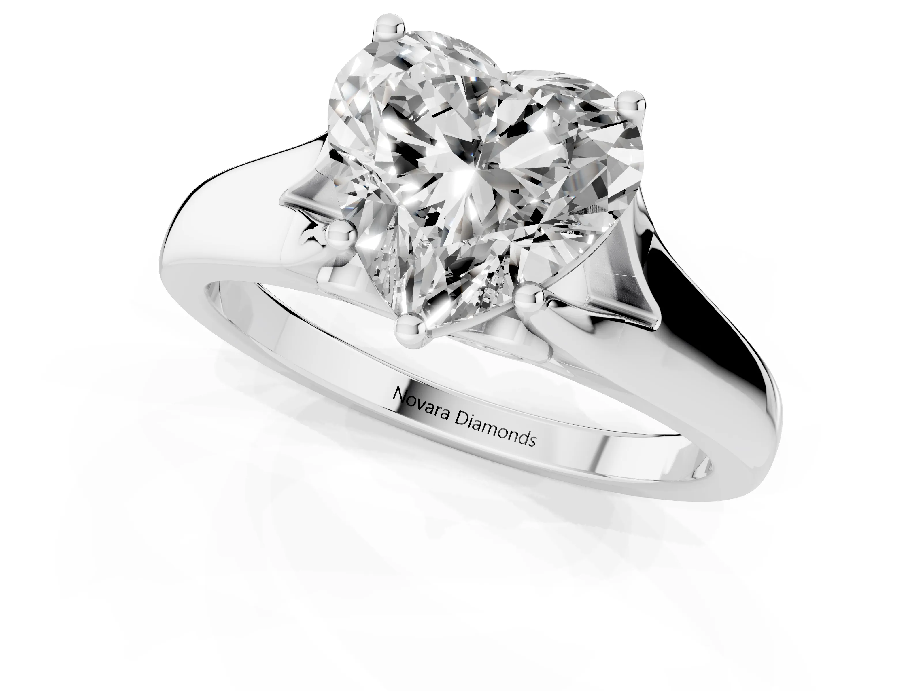 Heart Cut Diamond Solitaire Ring Set in White gold with Arched Cathedral Band and Prong Setting
