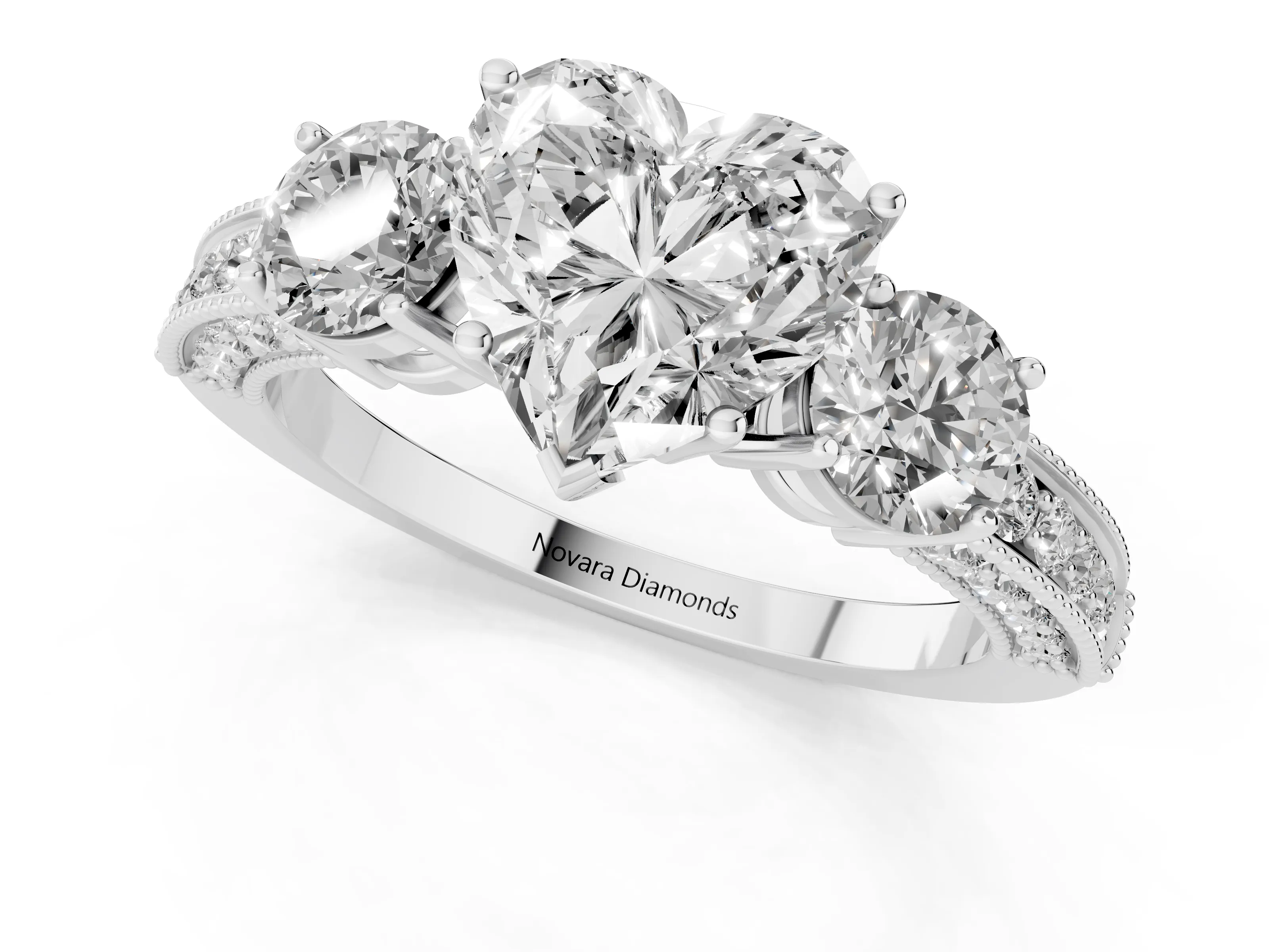 Heart Cut Diamond Three-Stone Ring Set in Platinum with Round Side Stones and Pavé Band