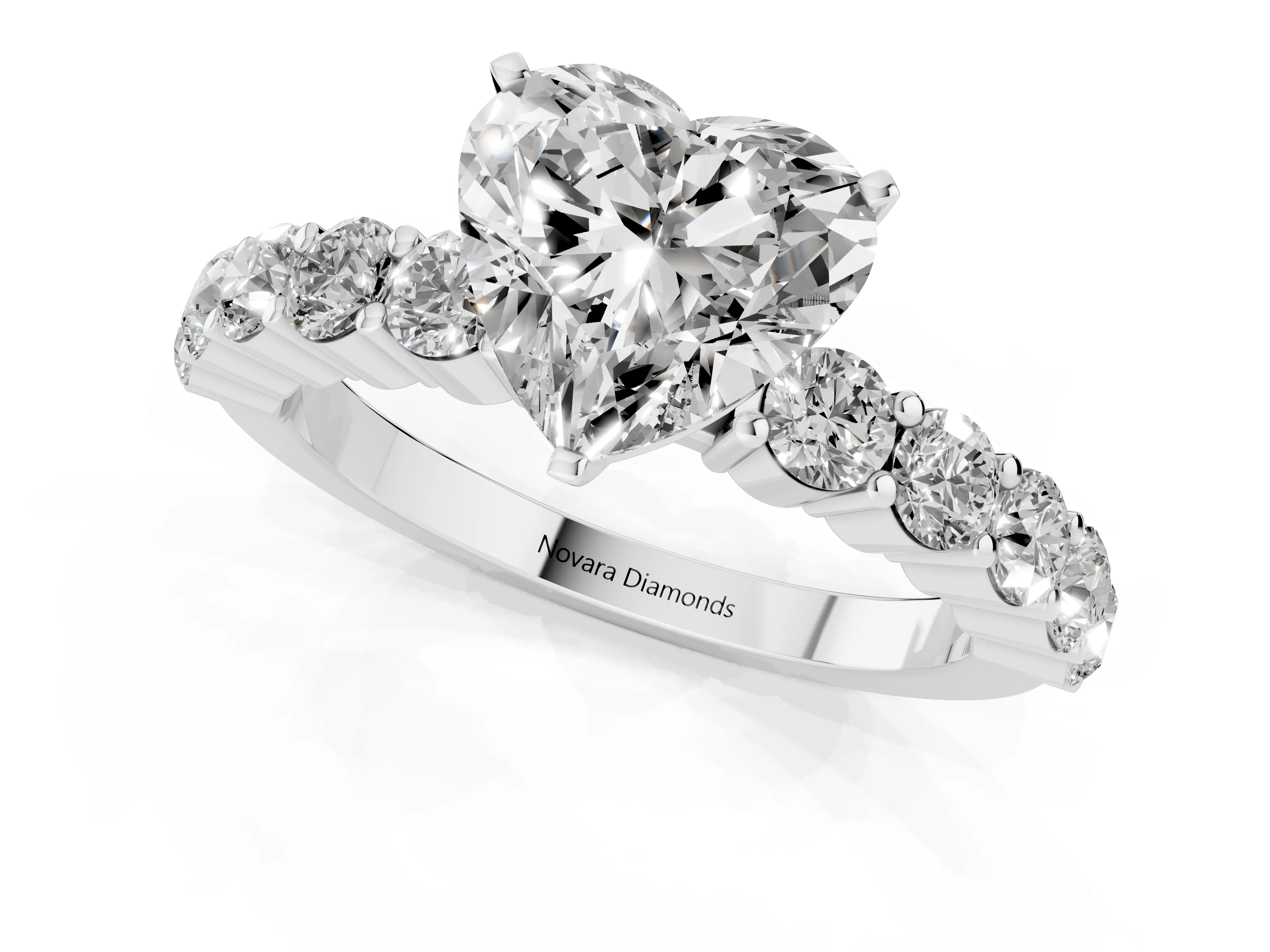 Heart Cut Diamond Solitaire Ring Set in White gold with Shared Prong Round Side Stones