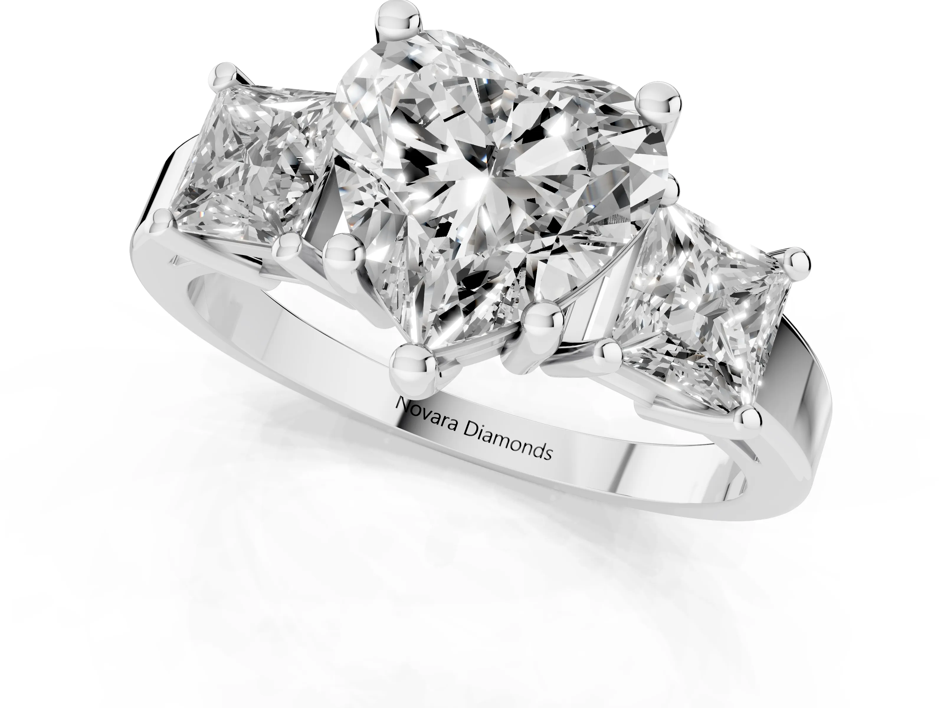 Three-Stone Heart Cut Diamond Solitaire Ring Set in Platinum with Prong Setting