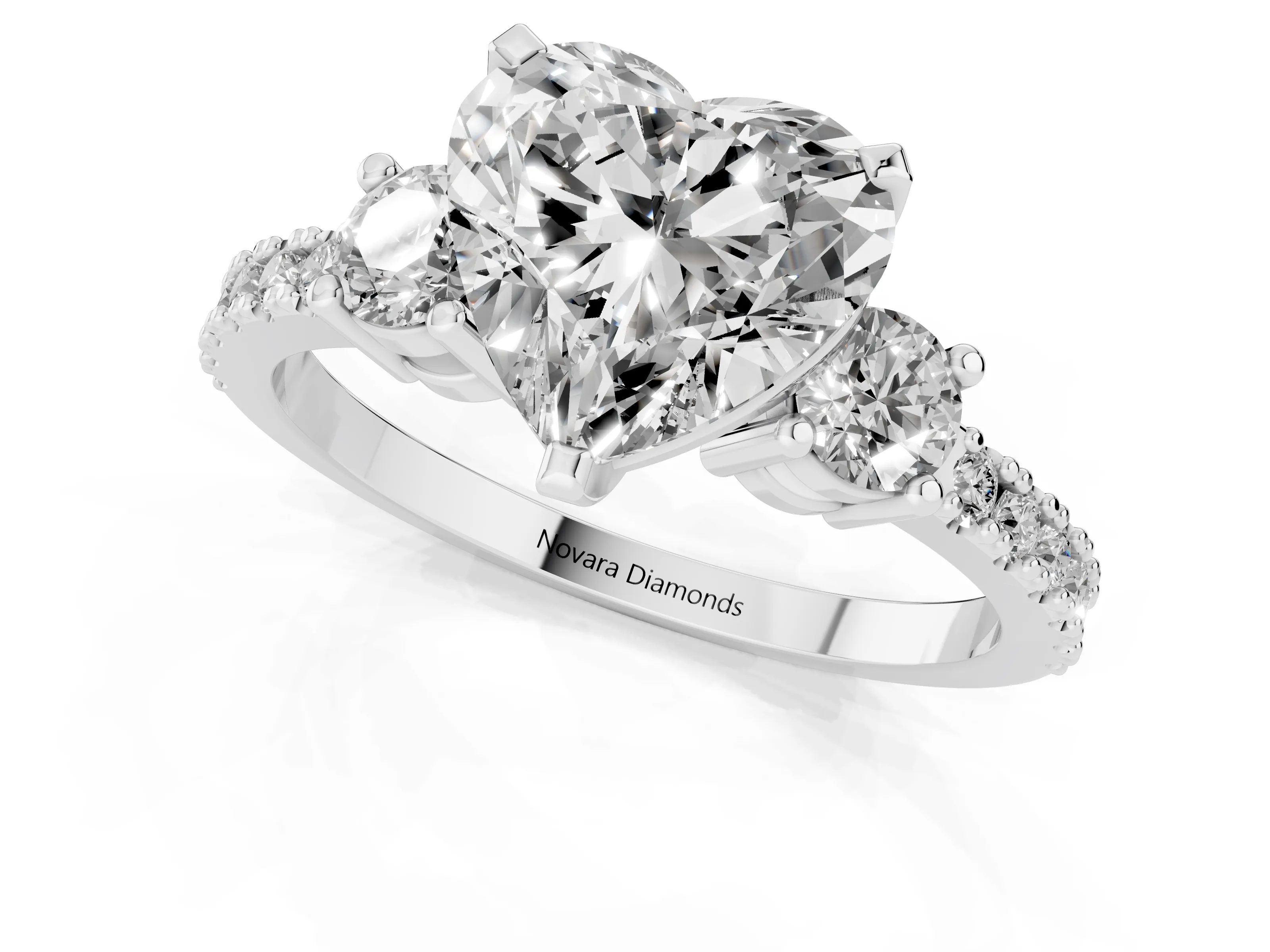 Three-Stone Heart Cut Diamond Pavé Band Ring Set in Platinum with Prong Setting