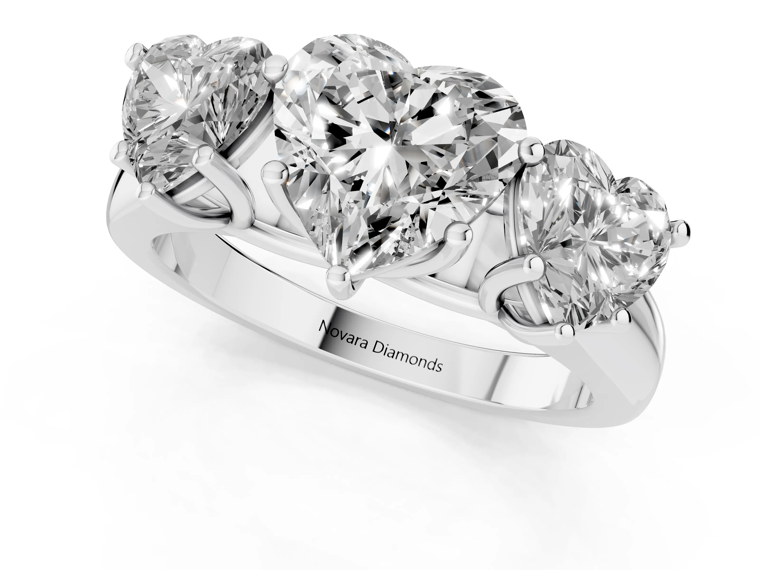 Heart Cut Diamond Three-Stone Ring Set in Platinum with Plain Polished Band