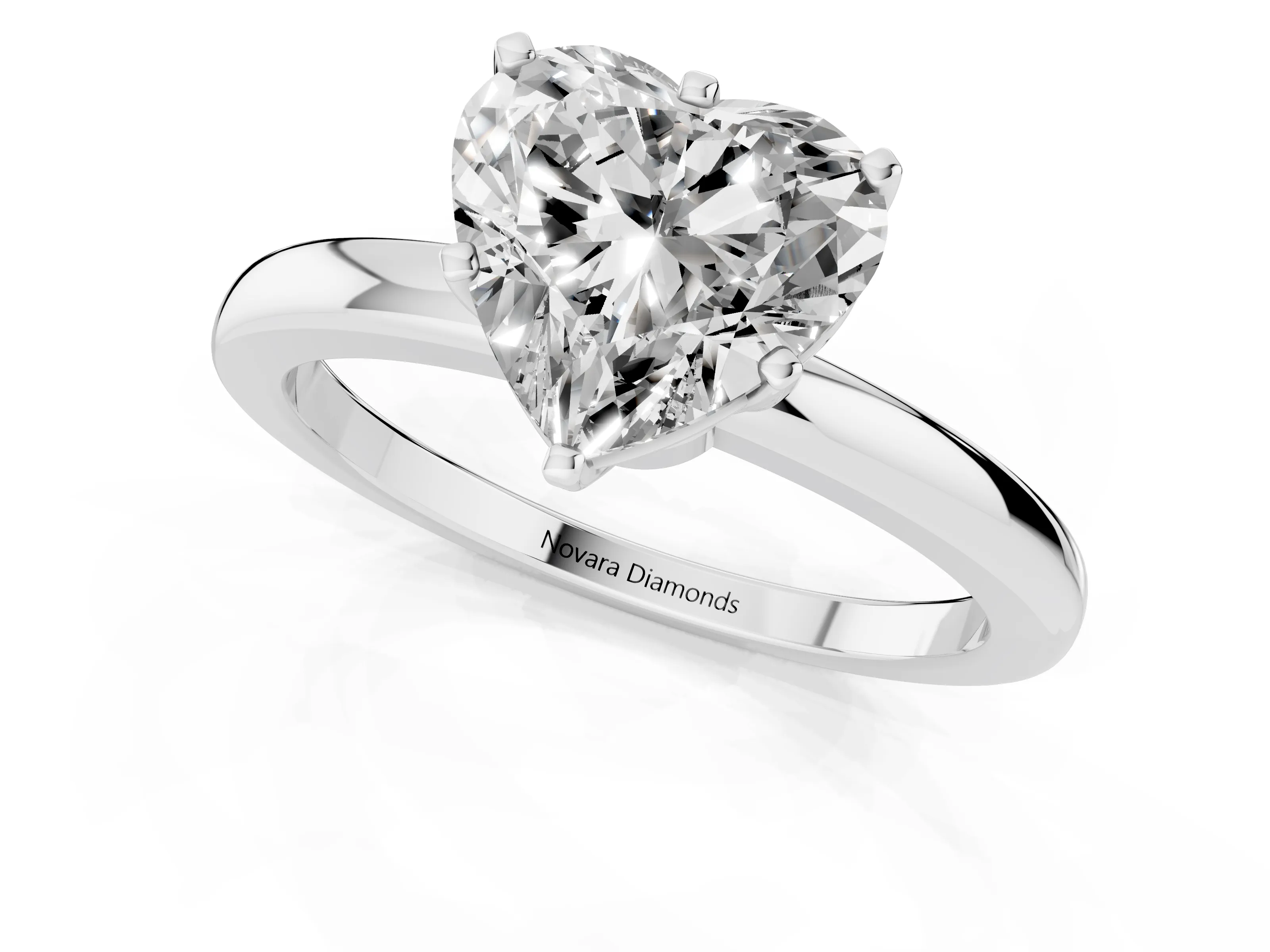 Heart Cut Diamond Solitaire Ring Set in White gold with Raised Prong Setting on a Classic Band