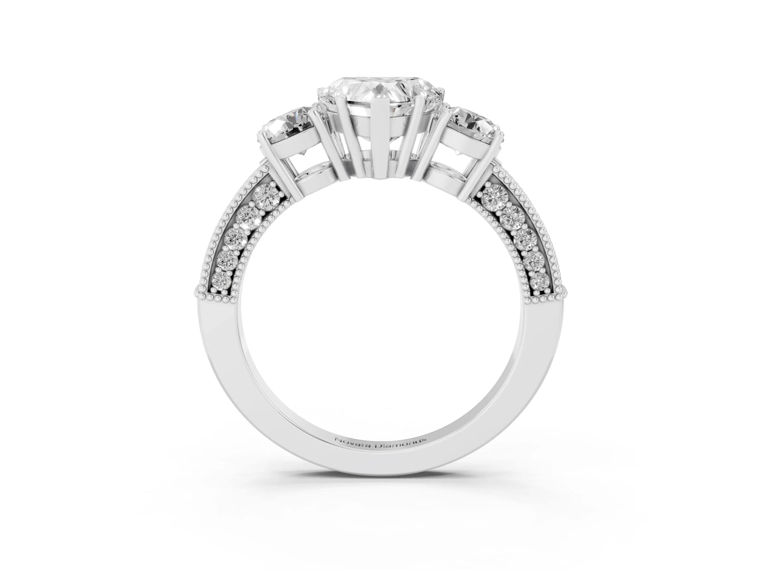 Heart Cut Diamond Three-Stone Ring Set in Platinum with Round Side Stones and Pavé Band