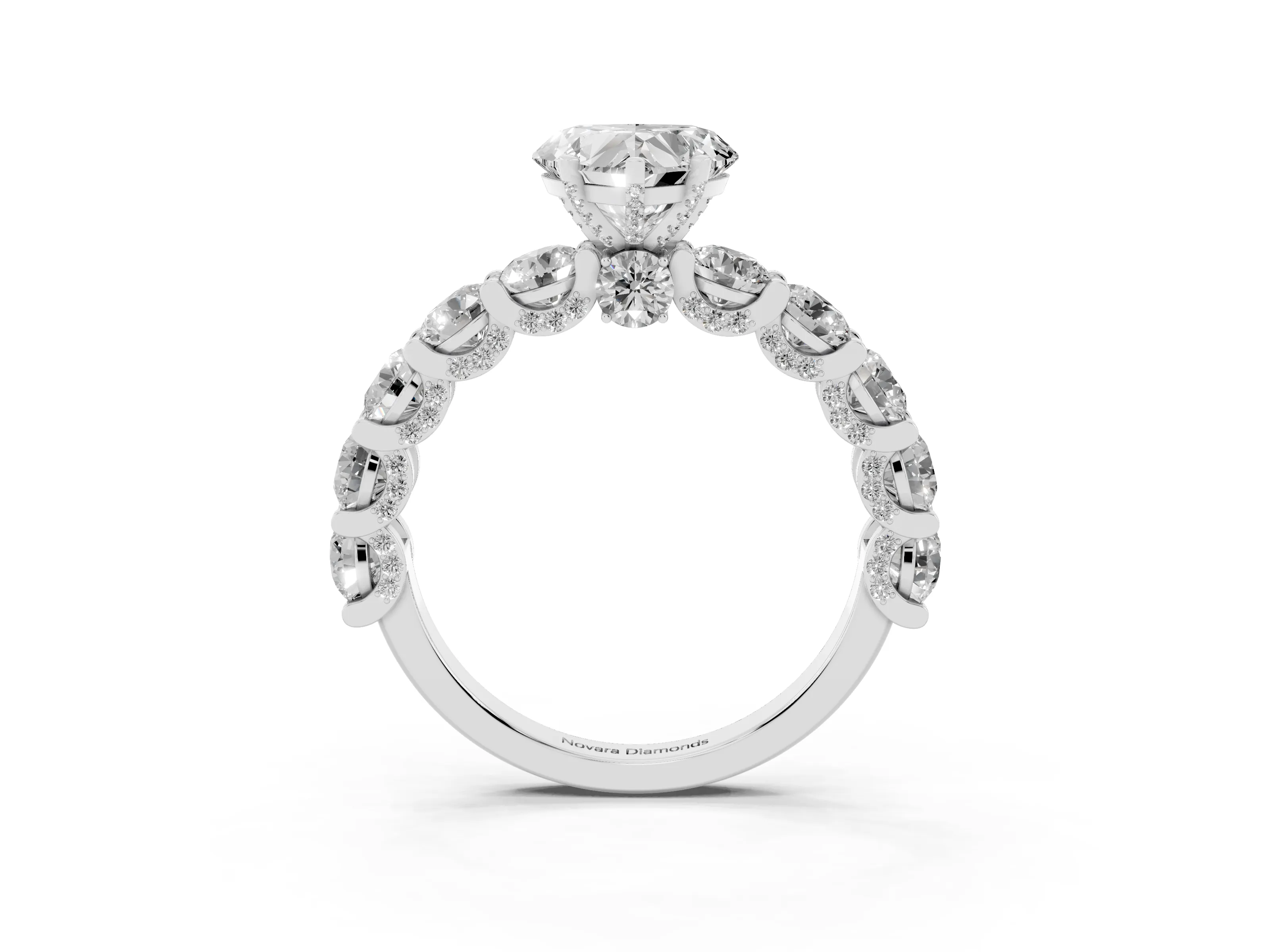 Heart Cut Diamond Side Stone Ring Set in Platinum with Alternating Round and Oval Side Stones