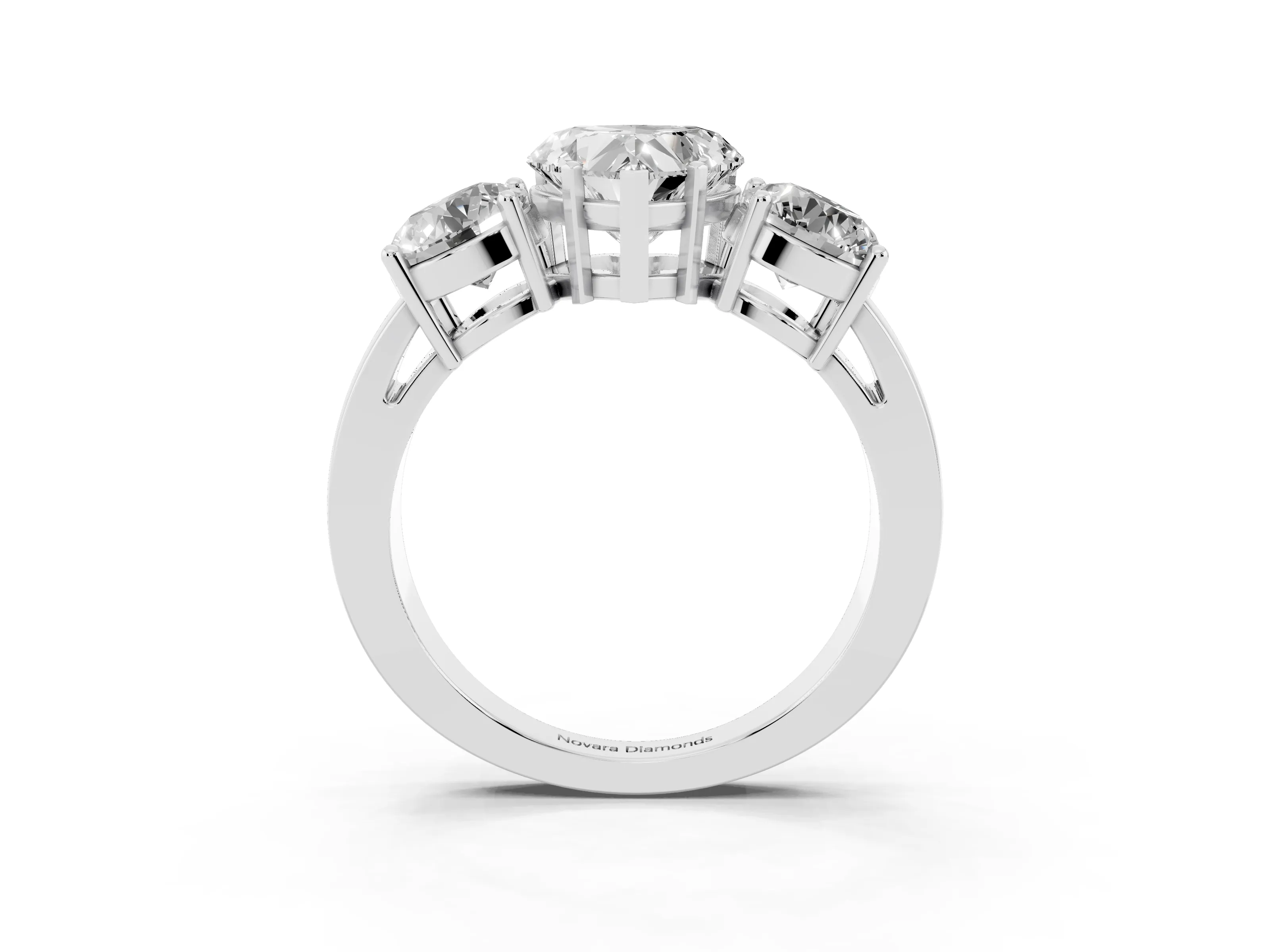 Heart Cut Diamond Three-Stone Ring Set in Platinum with Round Side Stones and Classic Band