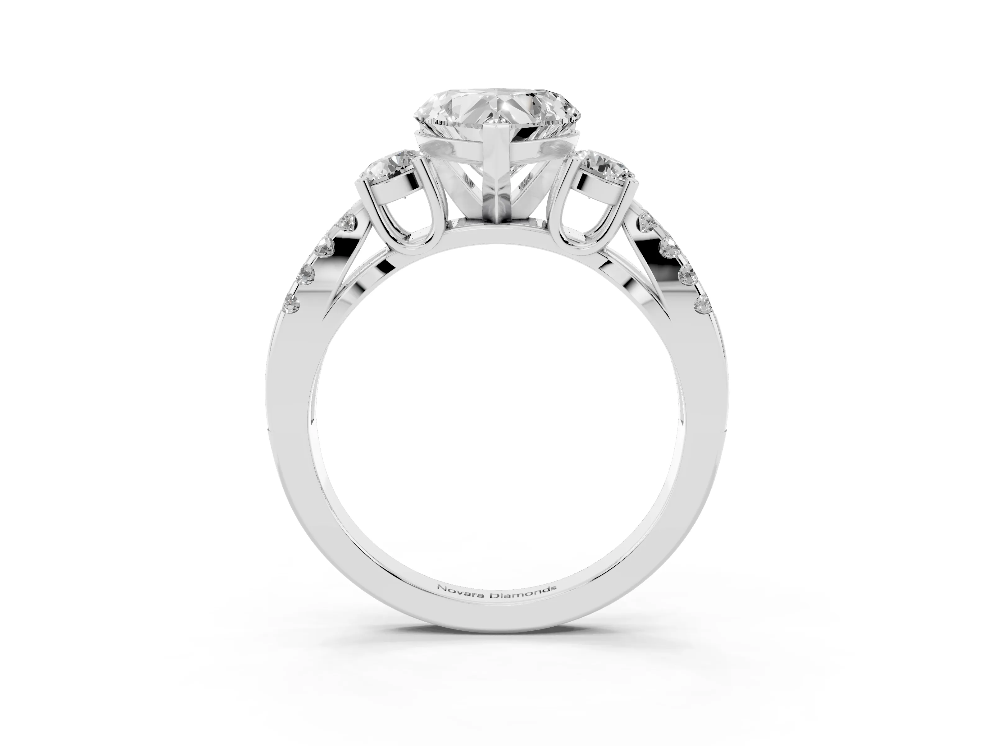 Heart Cut Diamond Three-Stone Ring Set in Platinum with Pavé Split Shank and Prong Setting