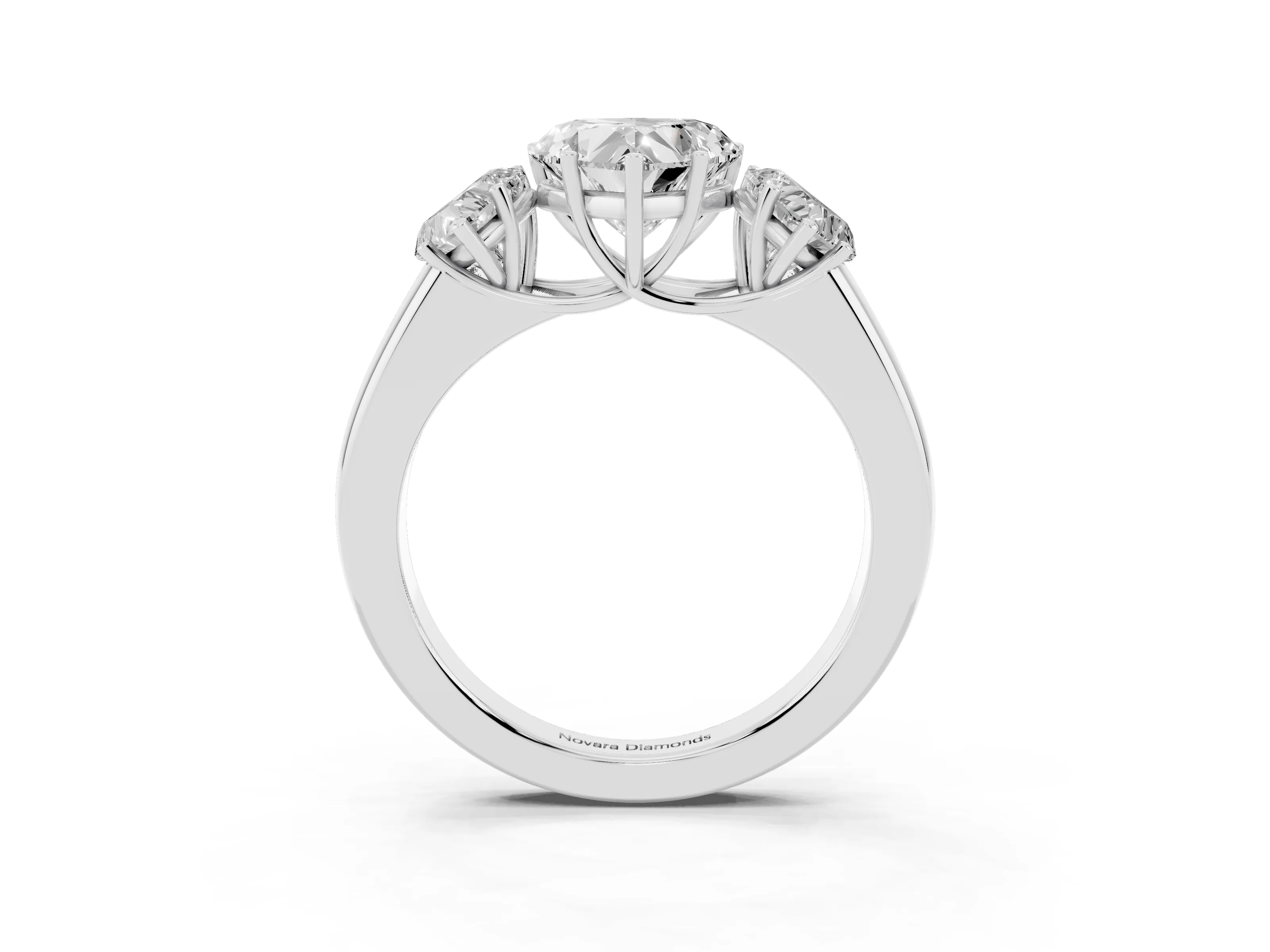 Three-Stone Heart Cut Diamond Ring Set in Platinum with Matching Prong Settings and Plain Band