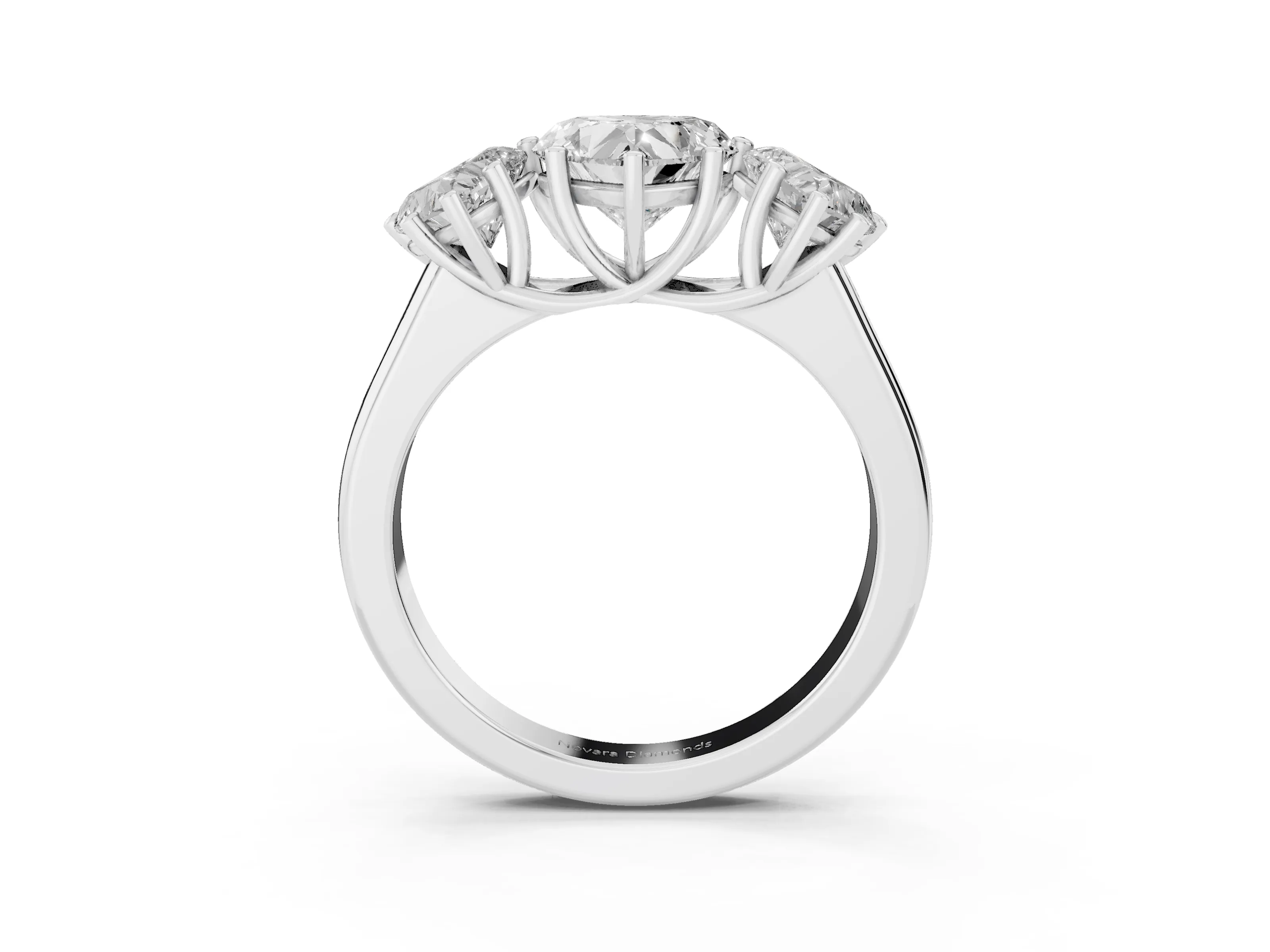 Heart Cut Diamond Three-Stone Ring Set in Platinum with Plain Polished Band