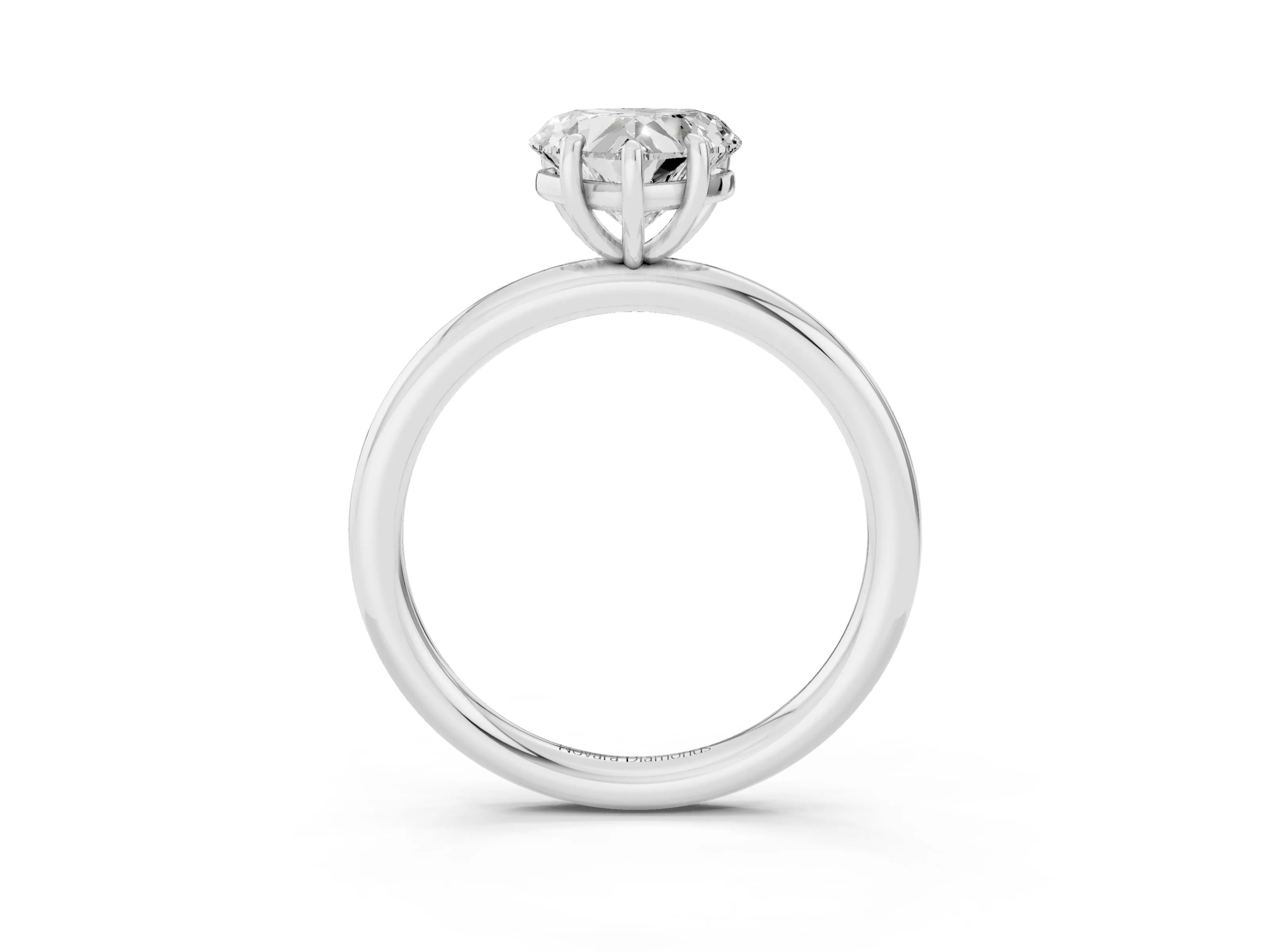 Heart Cut Diamond Solitaire Ring Set in Platinum with Prong Setting on a Polished Plain Band