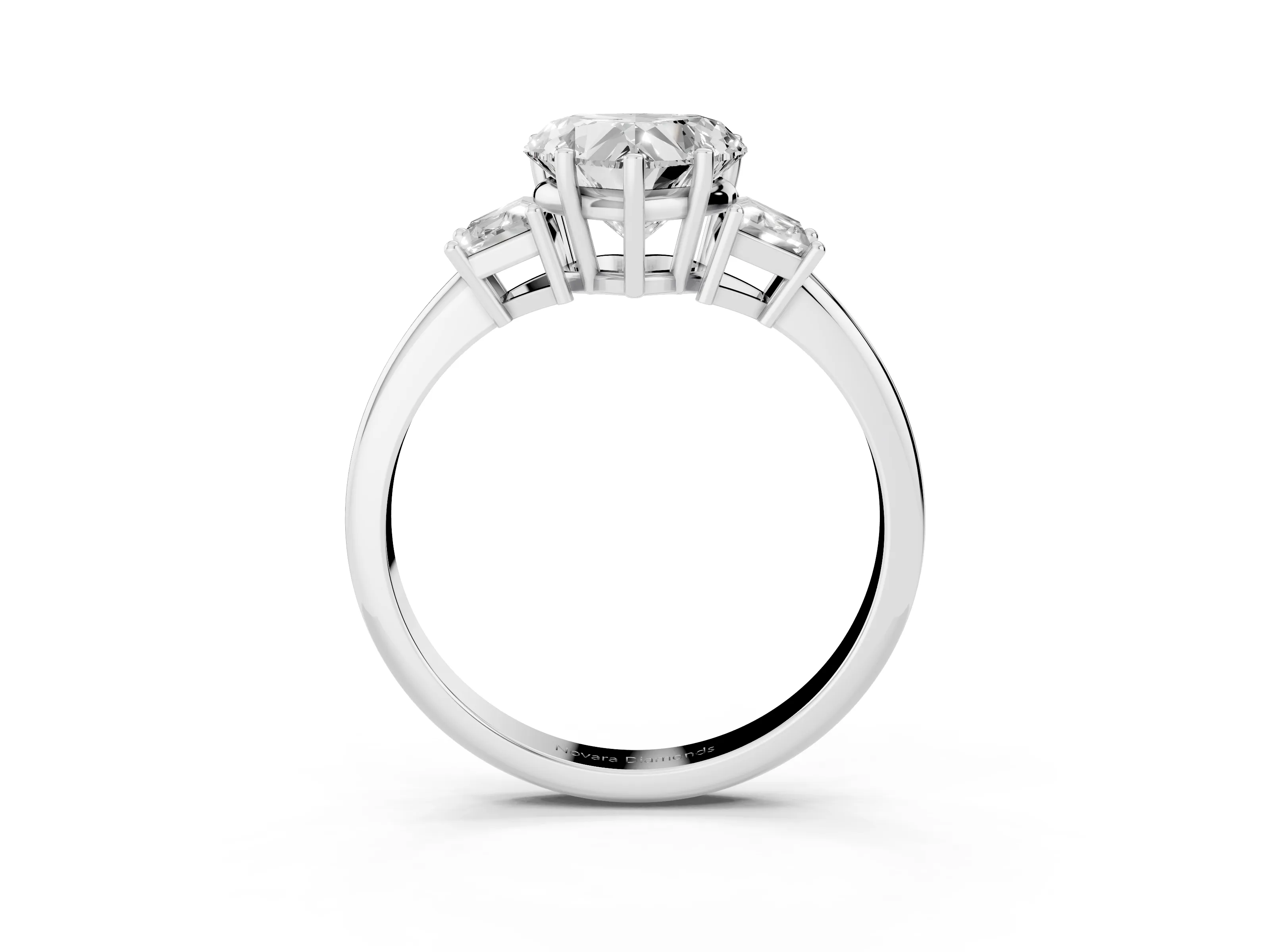 Heart Cut Diamond Three-Stone Ring Set in Platinum with Trapezoid Side Stones and Prong Setting