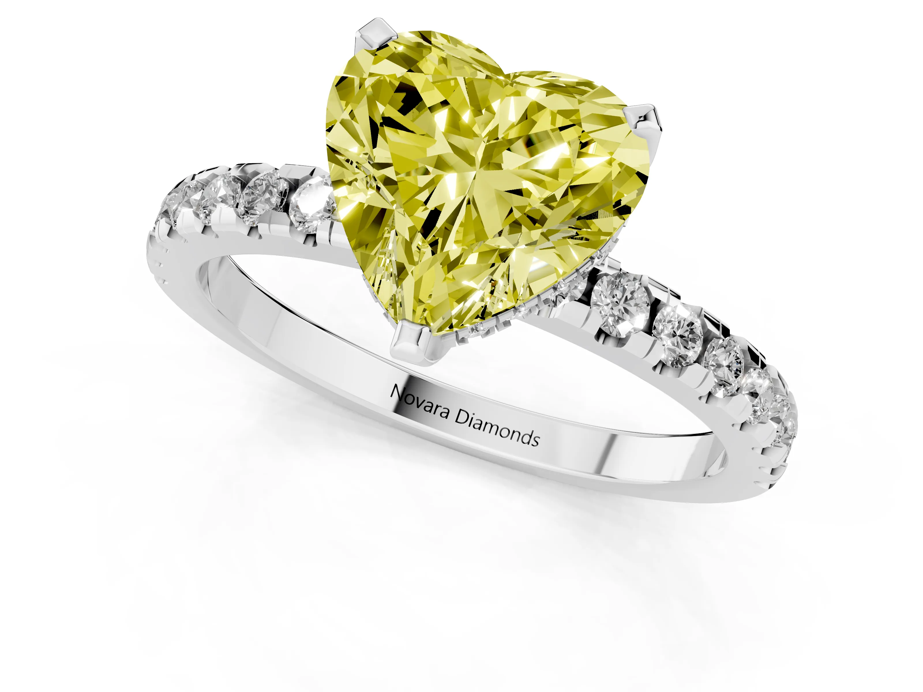 Fancy Yellow Heart Cut Diamond Pavé Solitaire Ring Set in White gold with Round Band Accents and Prong Setting