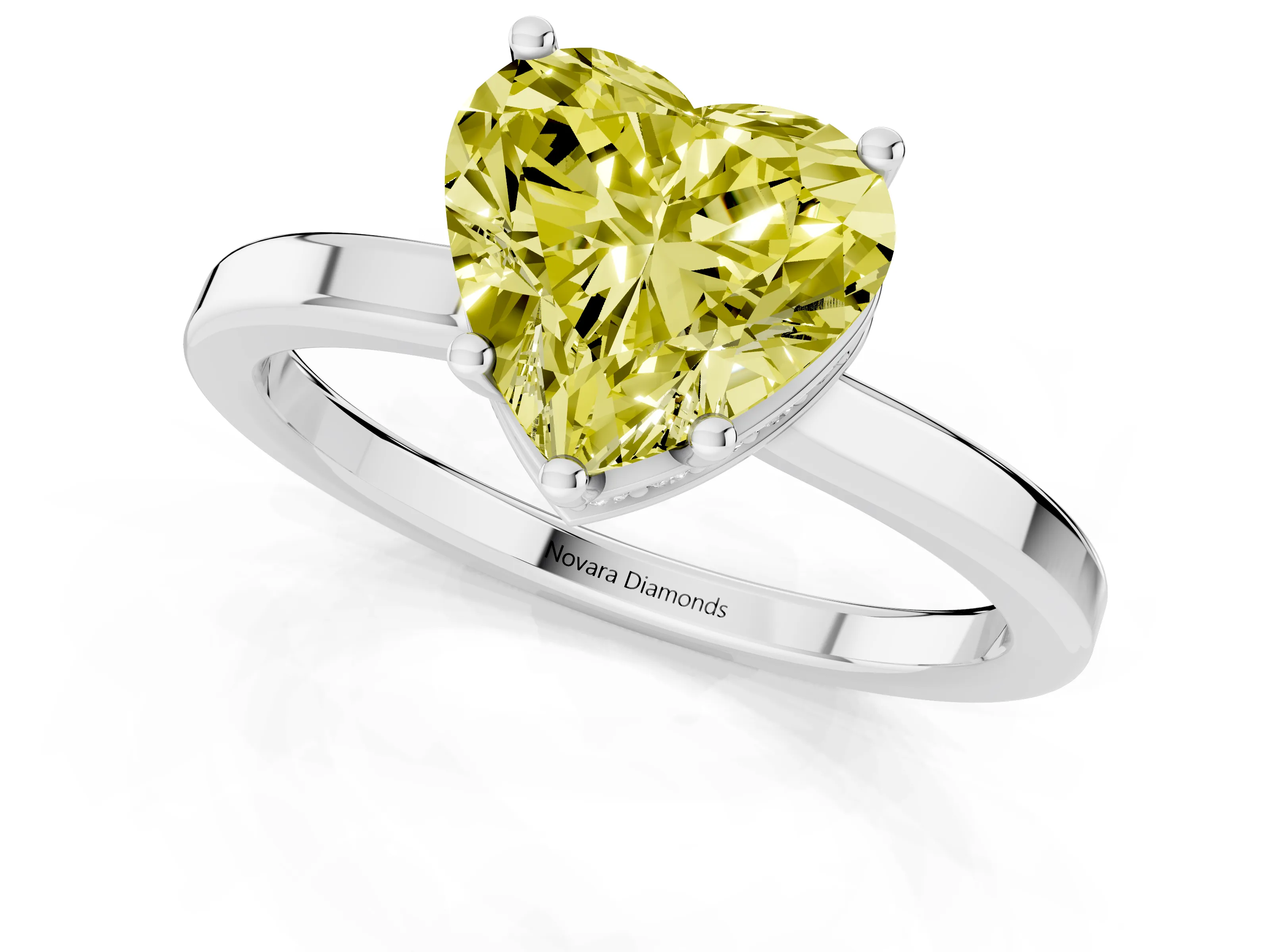 Fancy Yellow Heart Cut Diamond Solitaire Engagement Ring Set in White gold with Prong Setting on a Plain Band