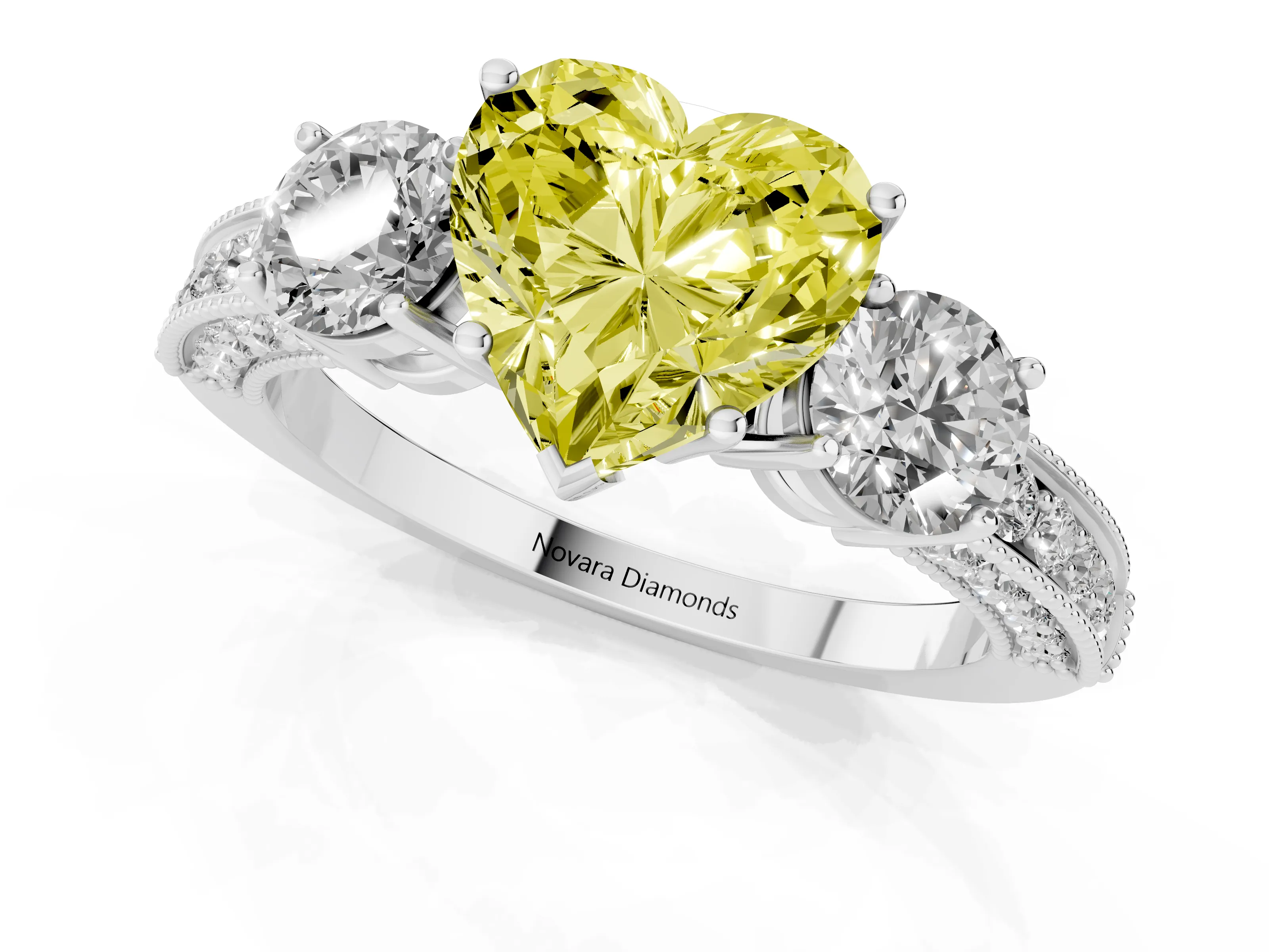 Fancy Yellow Heart Cut Diamond Three-Stone Ring Set in White gold with Round Side Stones and Pavé Band