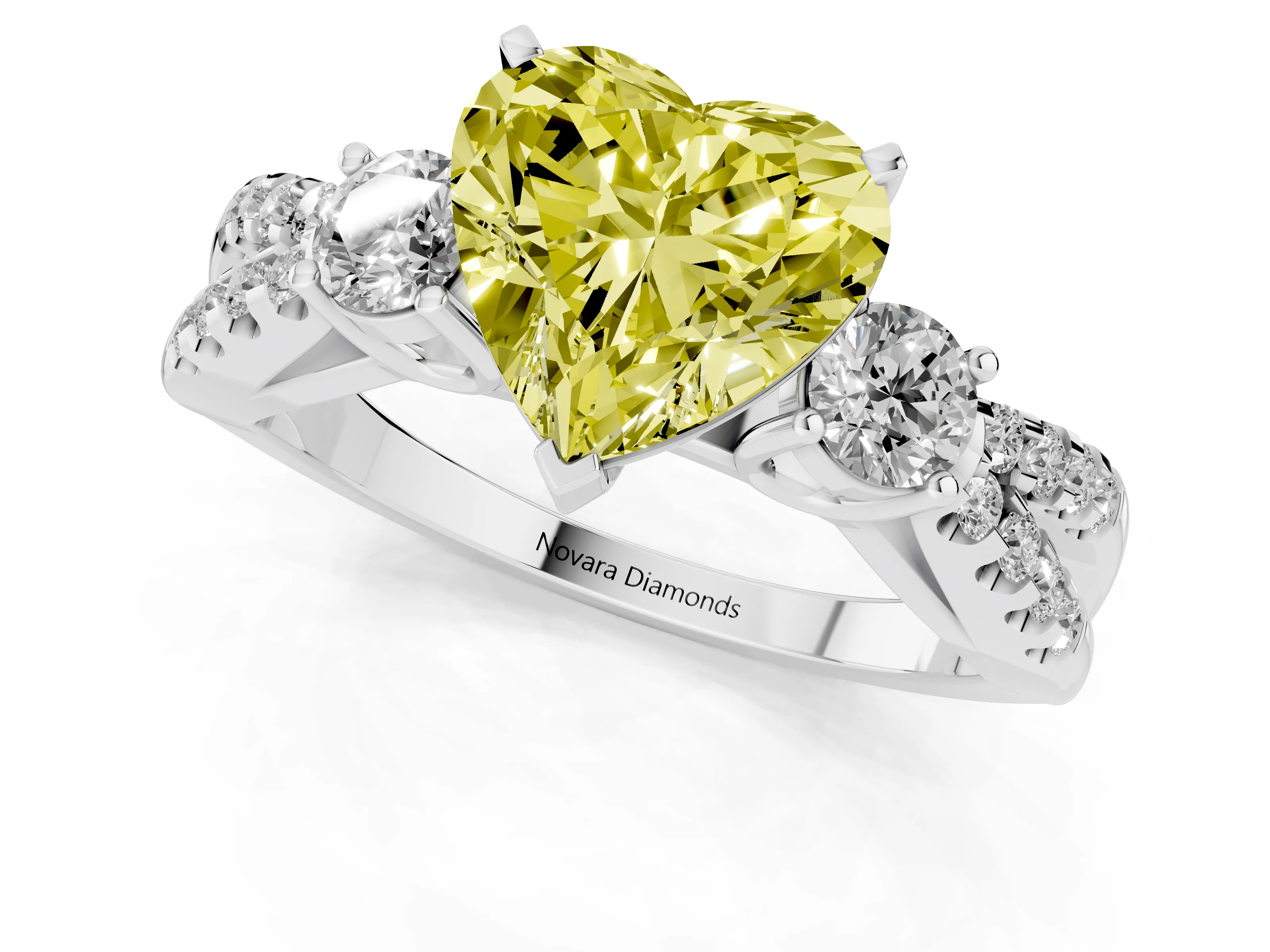 Fancy Yellow Heart Cut Diamond Three-Stone Ring Set in Platinum with Pavé Split Shank and Prong Setting