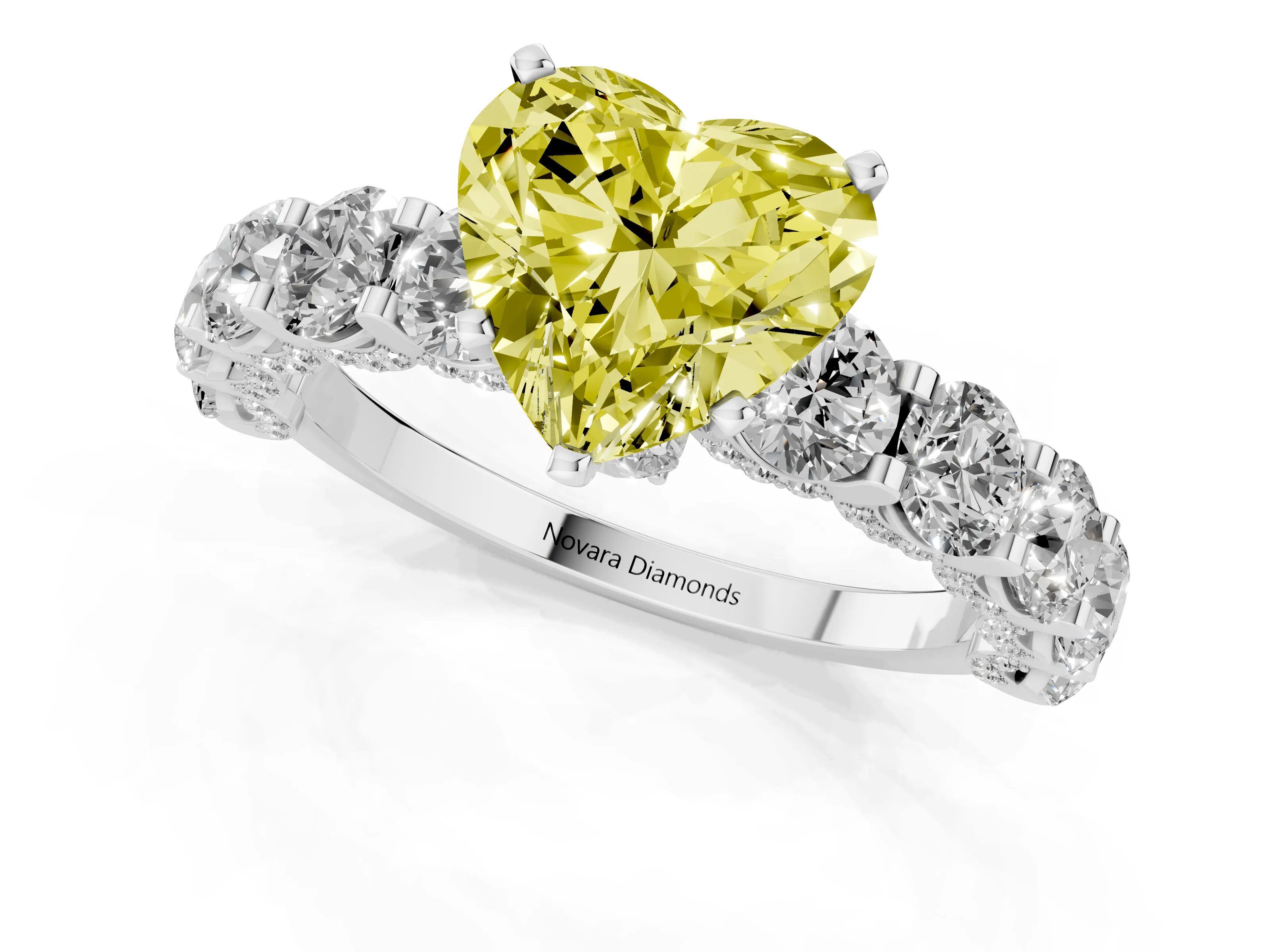 Fancy Yellow Heart Cut Diamond Side Stone Ring Set in White gold with Alternating Round and Oval Side Stones