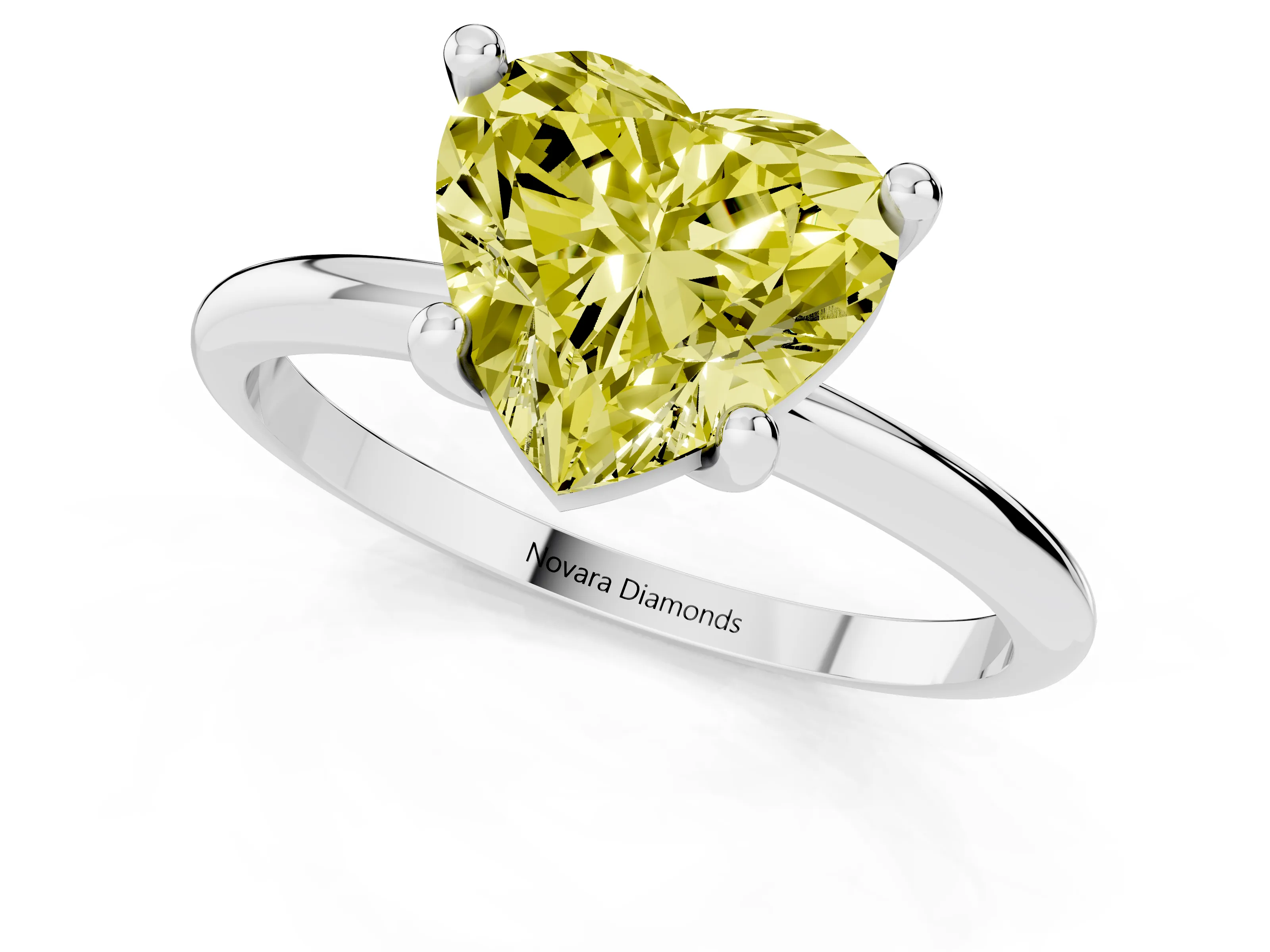 Fancy Yellow Heart Cut Diamond Solitaire Ring Set in Platinum with Secure Prong Setting on a Classic Band