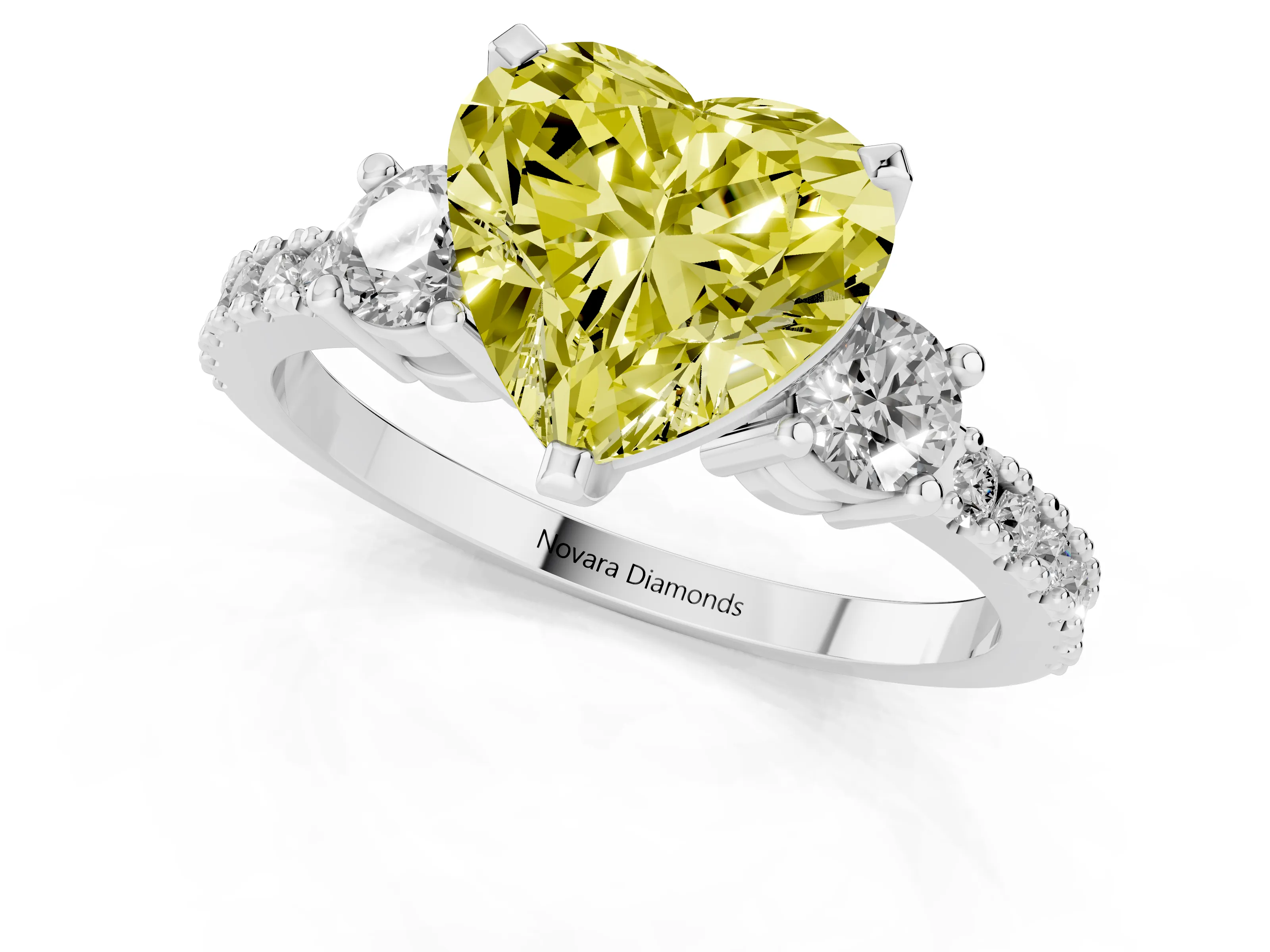 Fancy Yellow Three-Stone Heart Cut Diamond Pavé Band Ring Set in White gold with Prong Setting