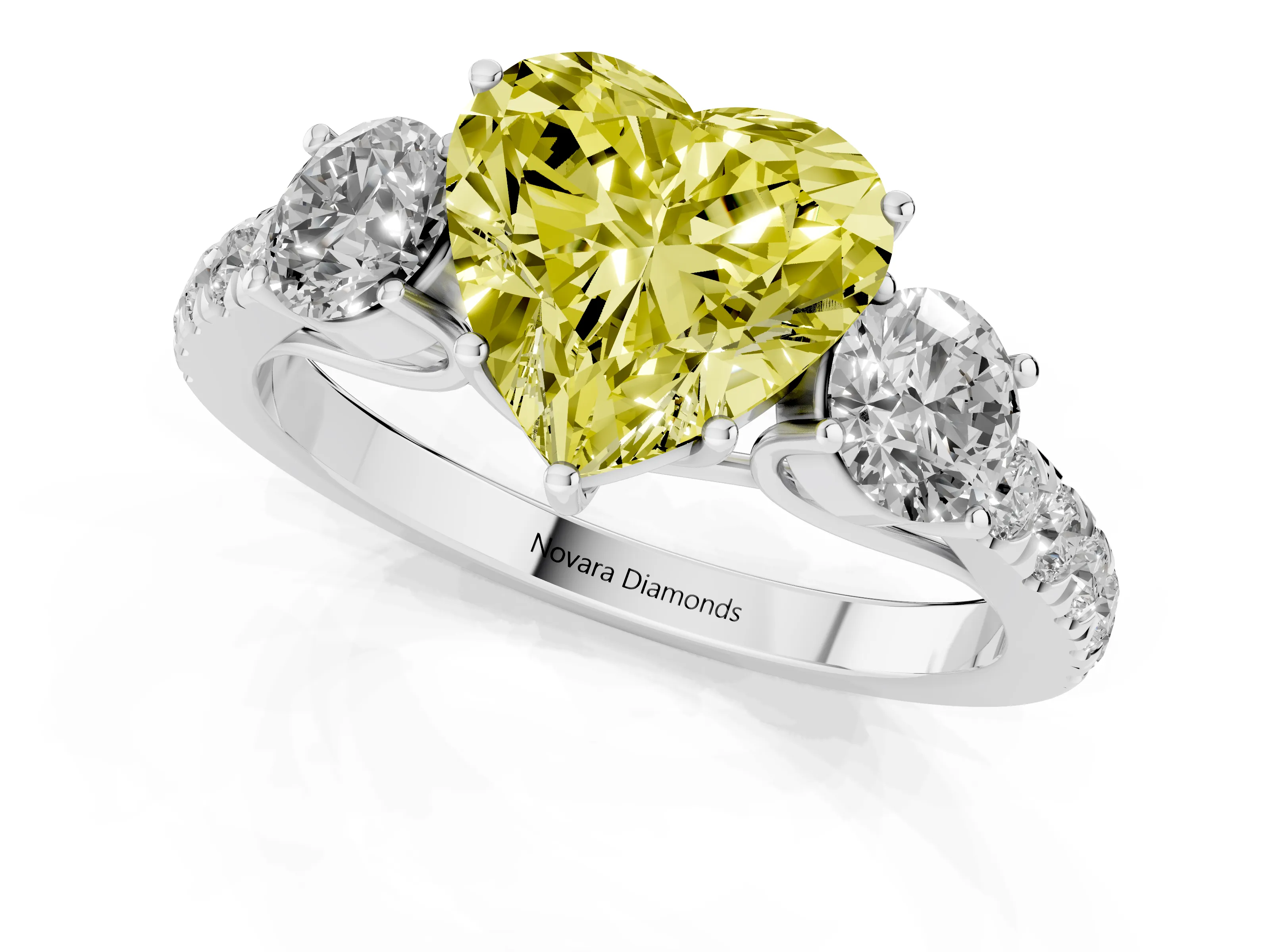 Fancy Yellow Heart Cut Diamond Three-Stone Ring Set in White gold with Round Side Stones and Delicate Pavé Band