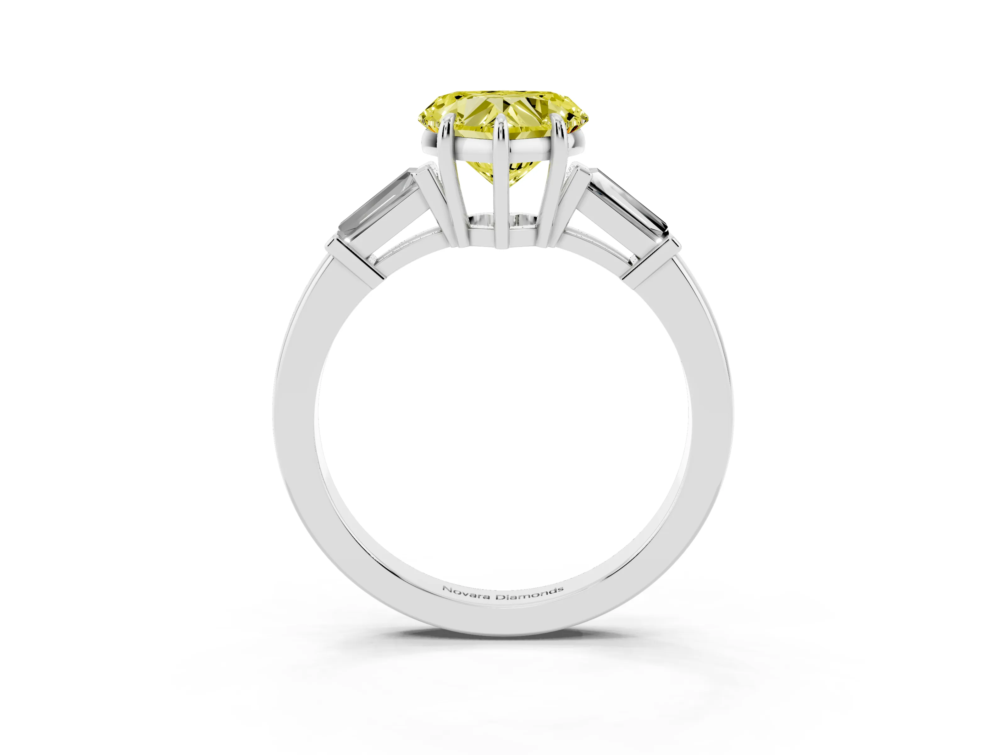 Fancy Yellow Heart Cut Diamond Three-Stone Ring Set in Platinum with Tapered Baguette Side Stones and Prong Setting