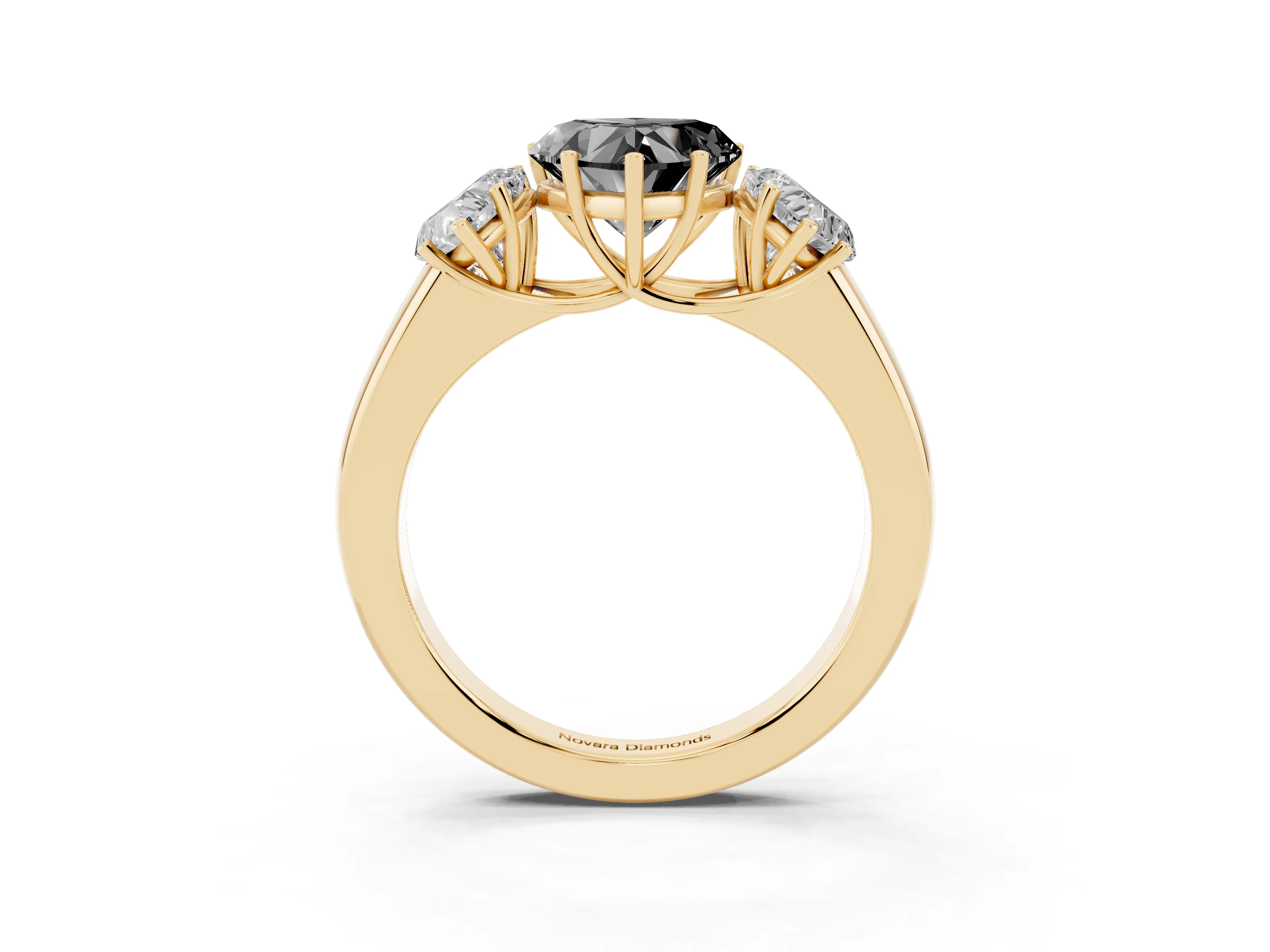 Fancy Black Three-Stone Heart Cut Diamond Ring Set in Yellow gold with Matching Prong Settings and Plain Band