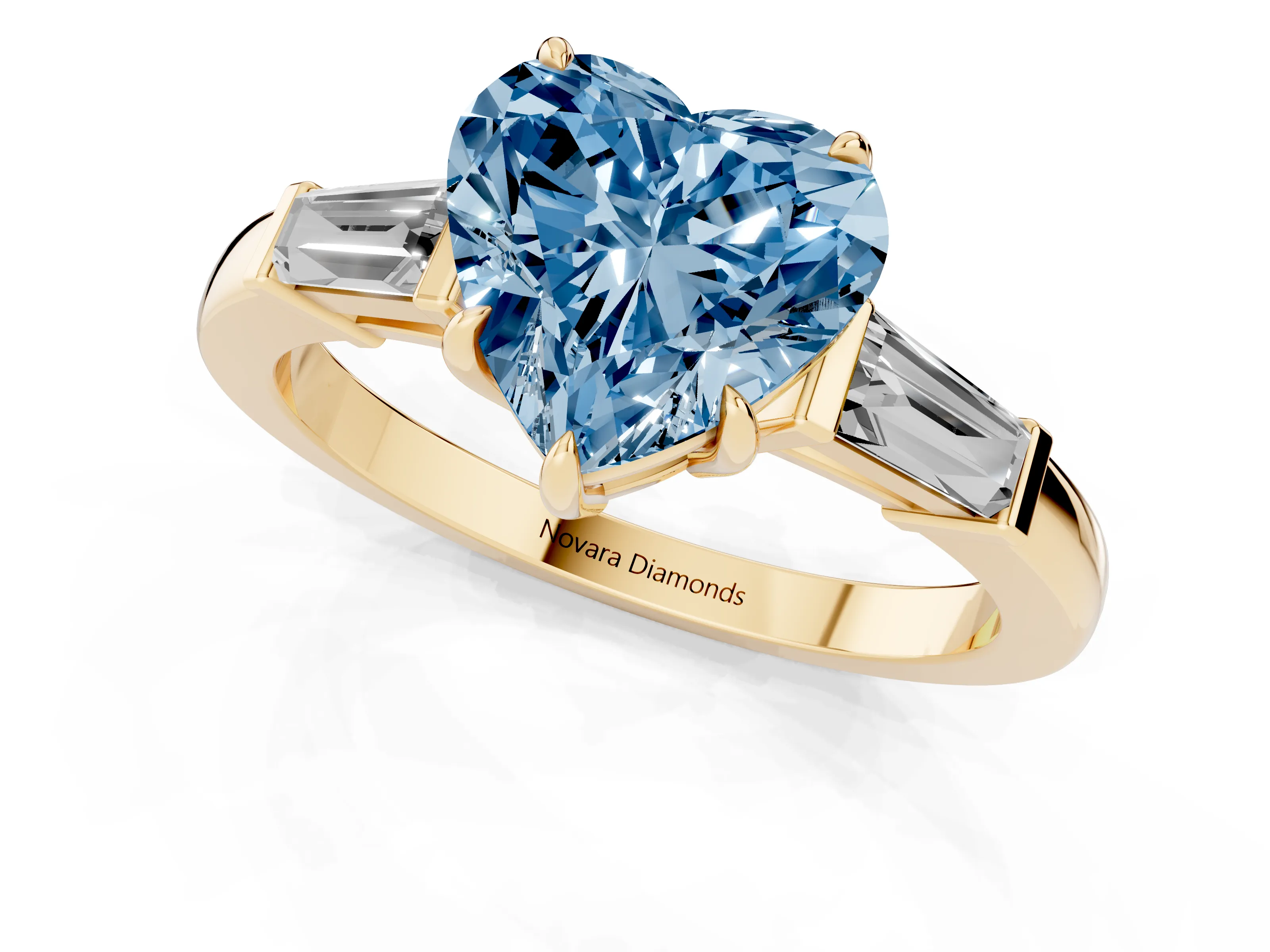 Fancy Blue Heart Cut Diamond Three-Stone Ring Set in Yellow gold with Tapered Baguette Side Stones and Prong Setting