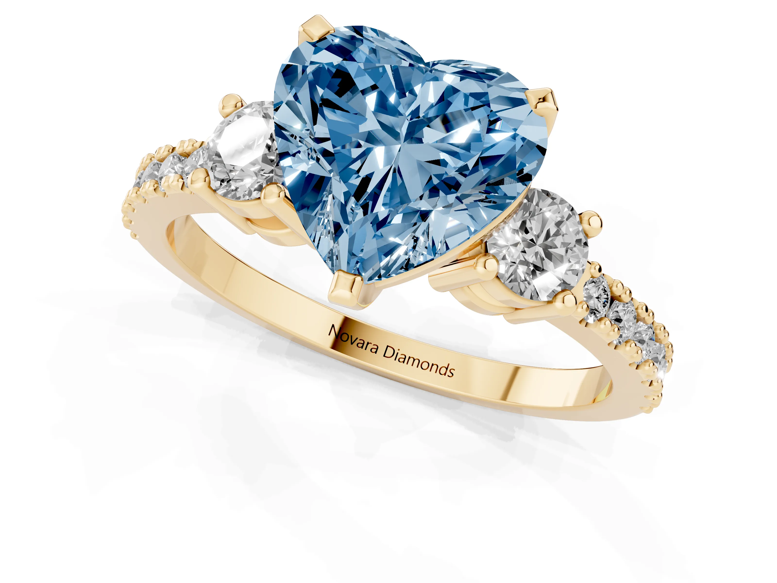 Fancy Blue Three-Stone Heart Cut Diamond Pavé Band Ring Set in Yellow gold with Prong Setting