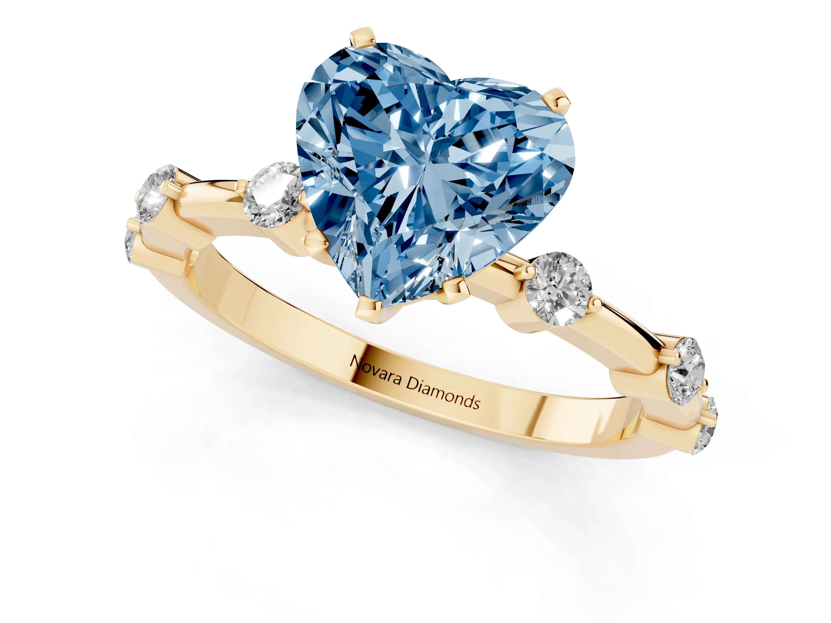 Fancy Blue Heart Cut Diamond Solitaire Ring Set in Yellow gold with Bezel Set Side Stones and Prong Setting