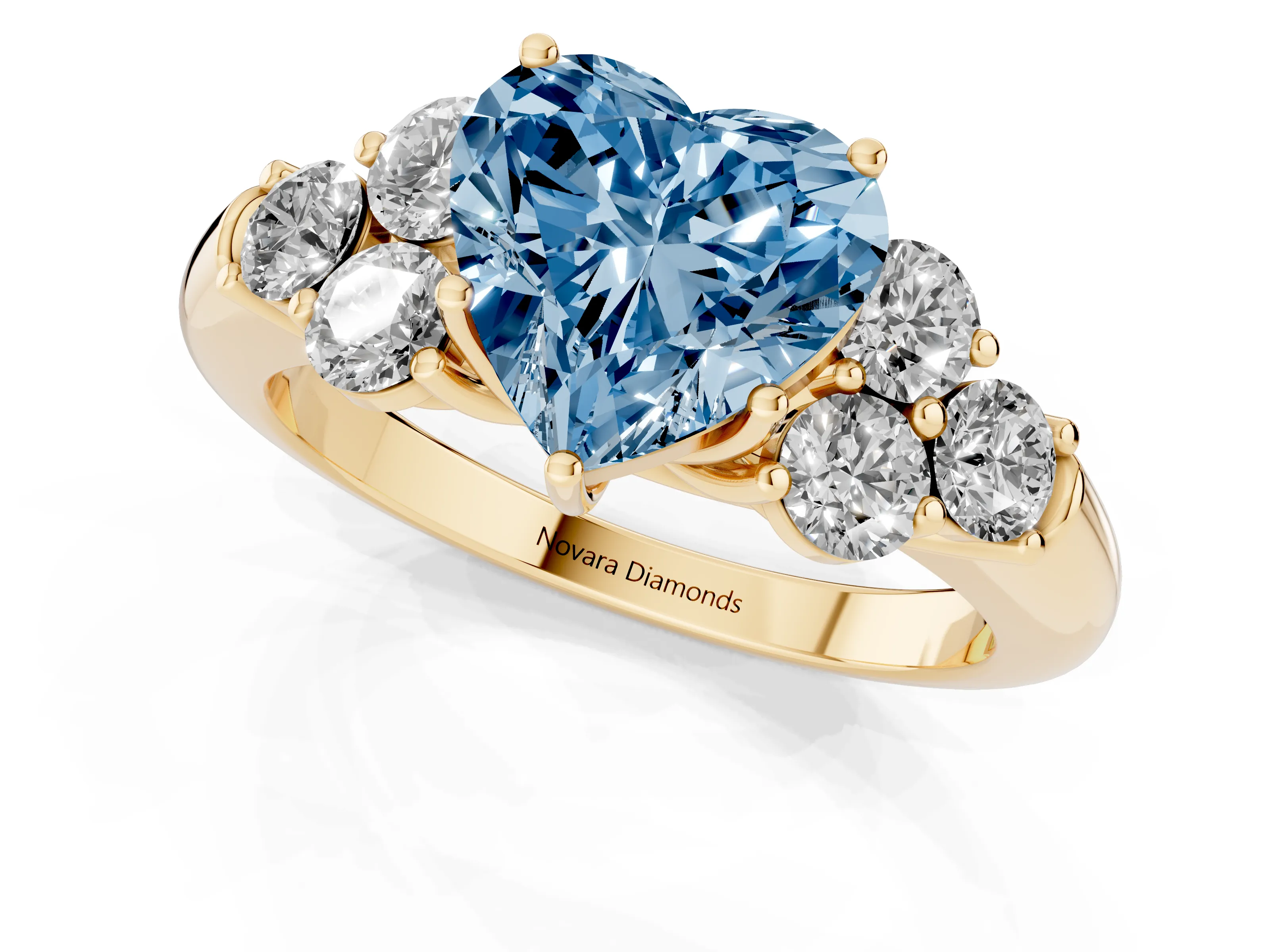 Fancy Blue Heart Cut Diamond Cluster Ring Set in Yellow gold with Round Accent Stones and Prong Setting on a Plain Band