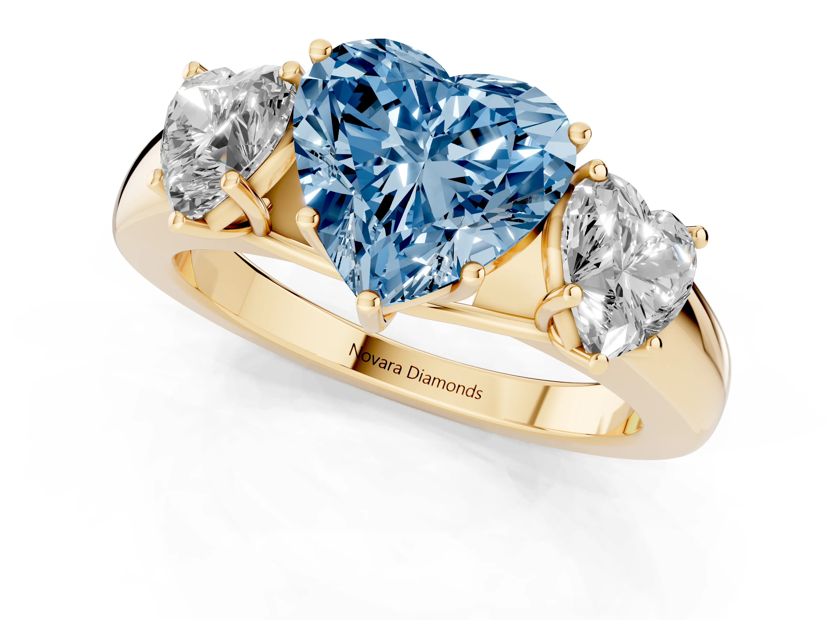 Fancy Blue Three-Stone Heart Cut Diamond Ring Set in Yellow gold with Matching Prong Settings and Plain Band