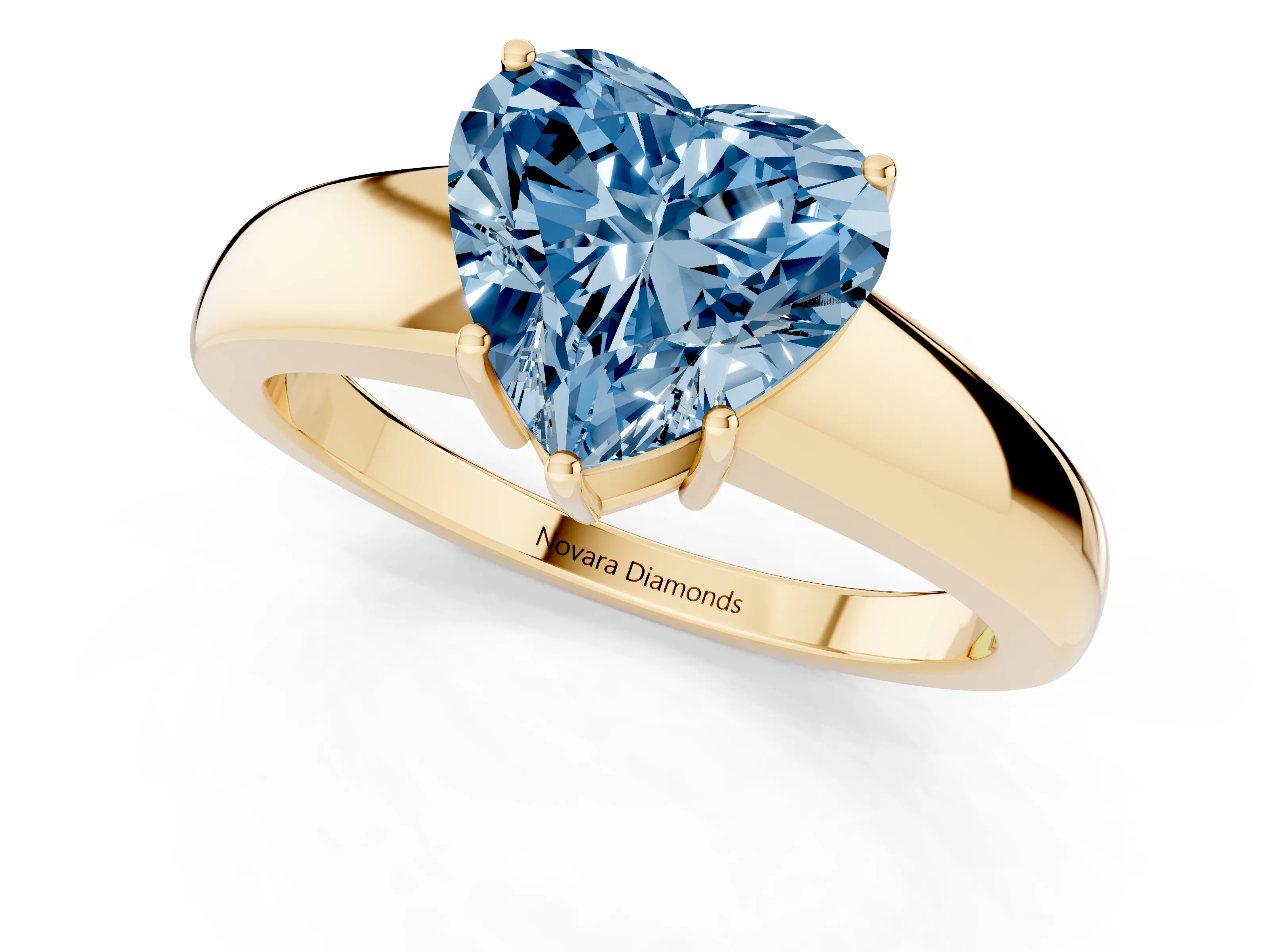 Fancy Blue Heart Cut Diamond Solitaire Ring Set in Yellow gold with Tapered Band and Prong Setting