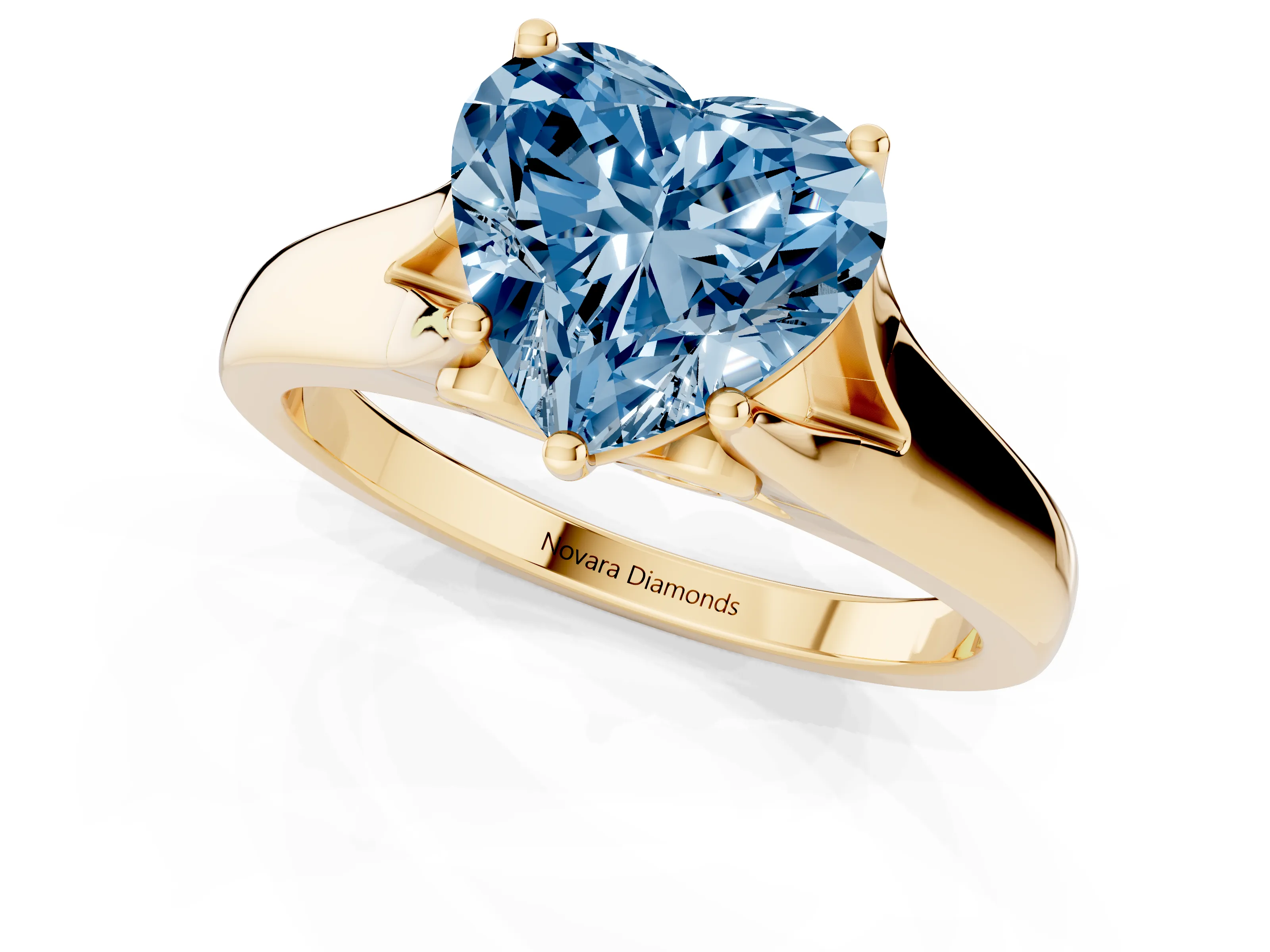 Fancy Blue Heart Cut Diamond Solitaire Ring Set in Yellow gold with Arched Cathedral Band and Prong Setting
