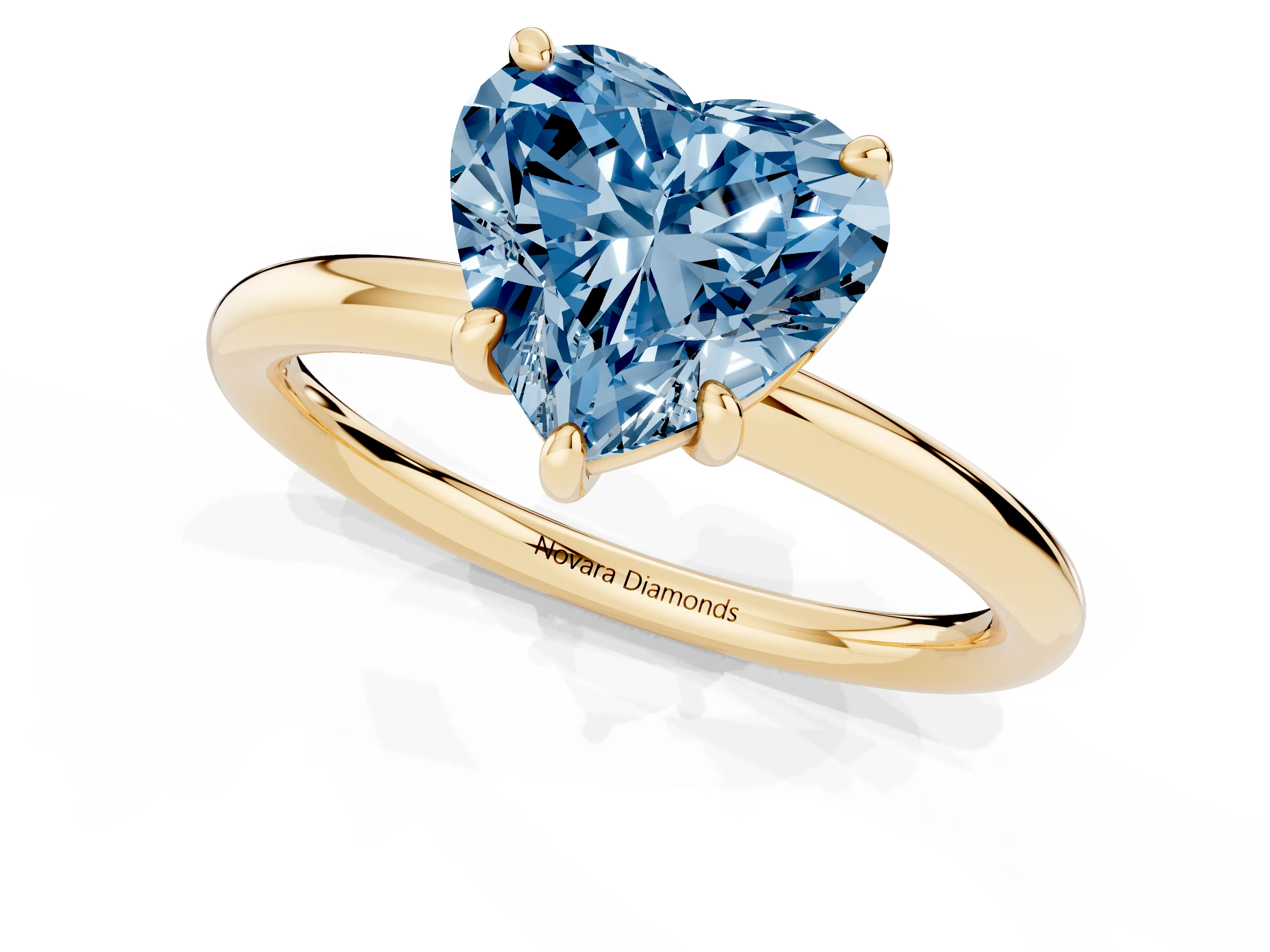 Fancy Blue Heart Cut Diamond Solitaire Ring Set in Yellow gold with Prong Setting on a Polished Plain Band