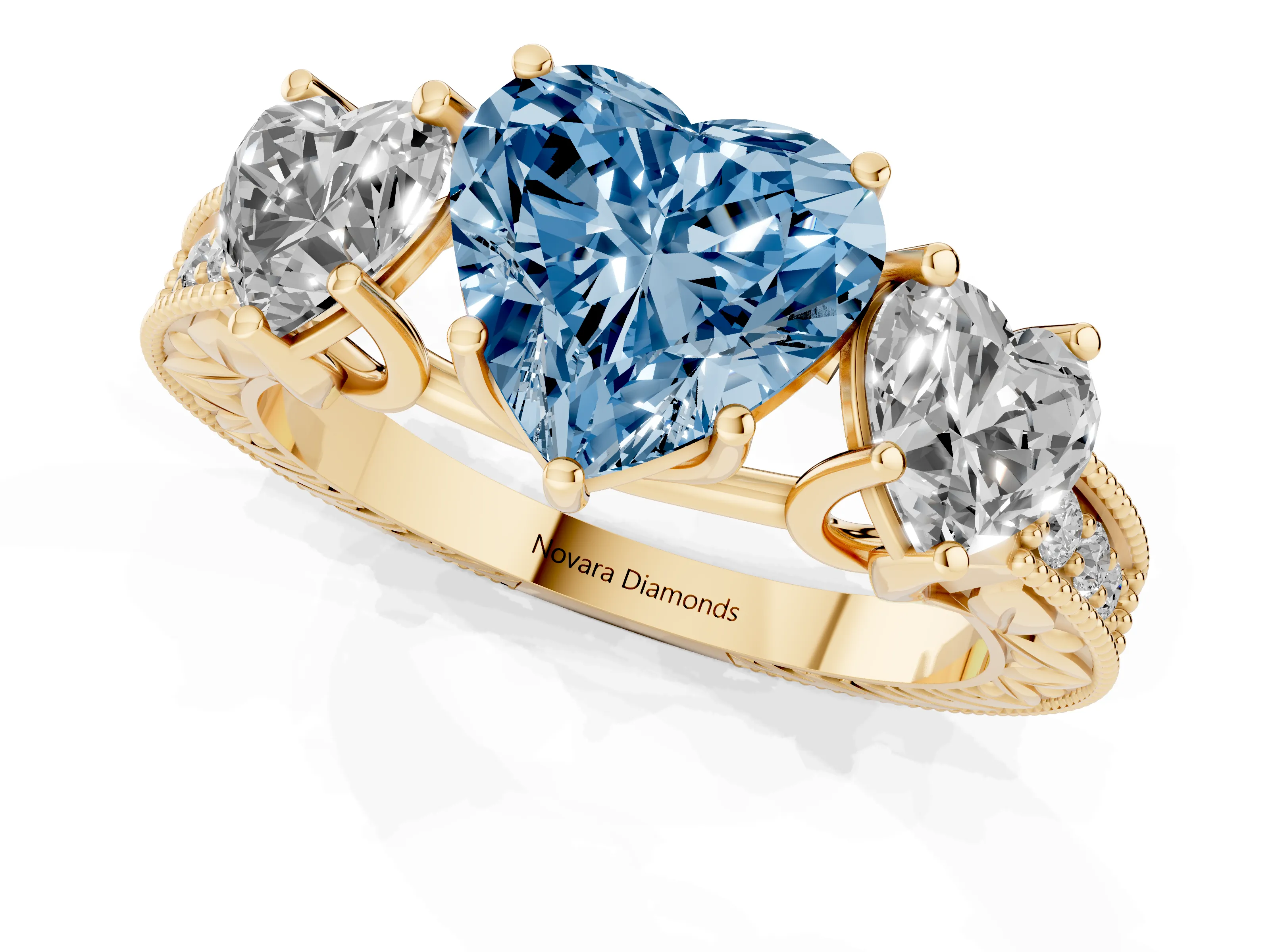 Fancy Blue Heart Cut Diamond Three-Stone Engagement Ring Set in Yellow gold with Milgrain Pavé Band