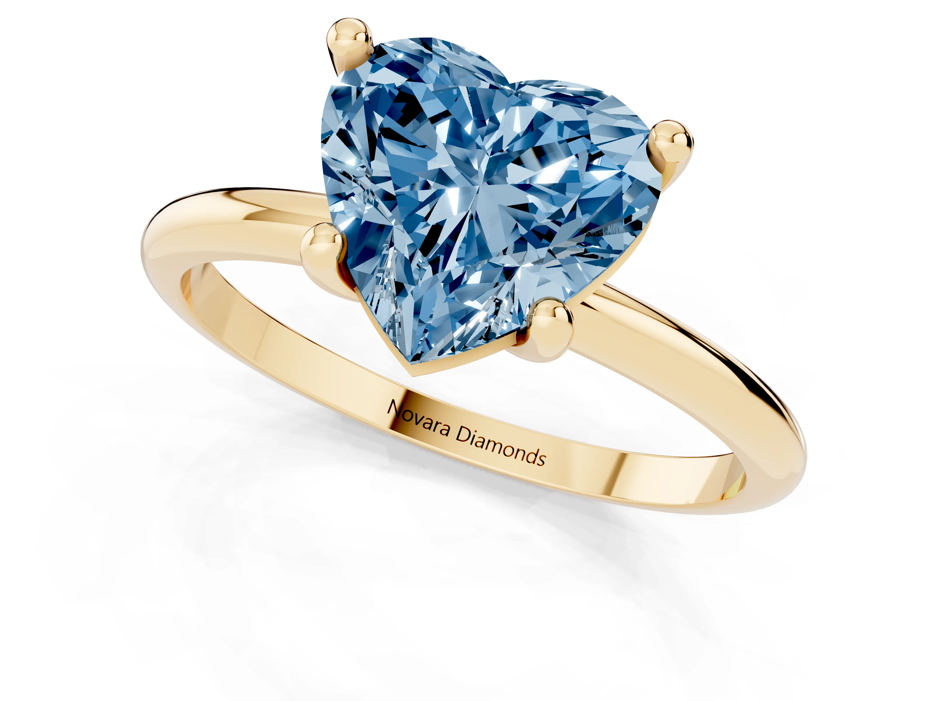 Fancy Blue Heart Cut Diamond Solitaire Ring Set in Yellow gold with Secure Prong Setting on a Classic Band