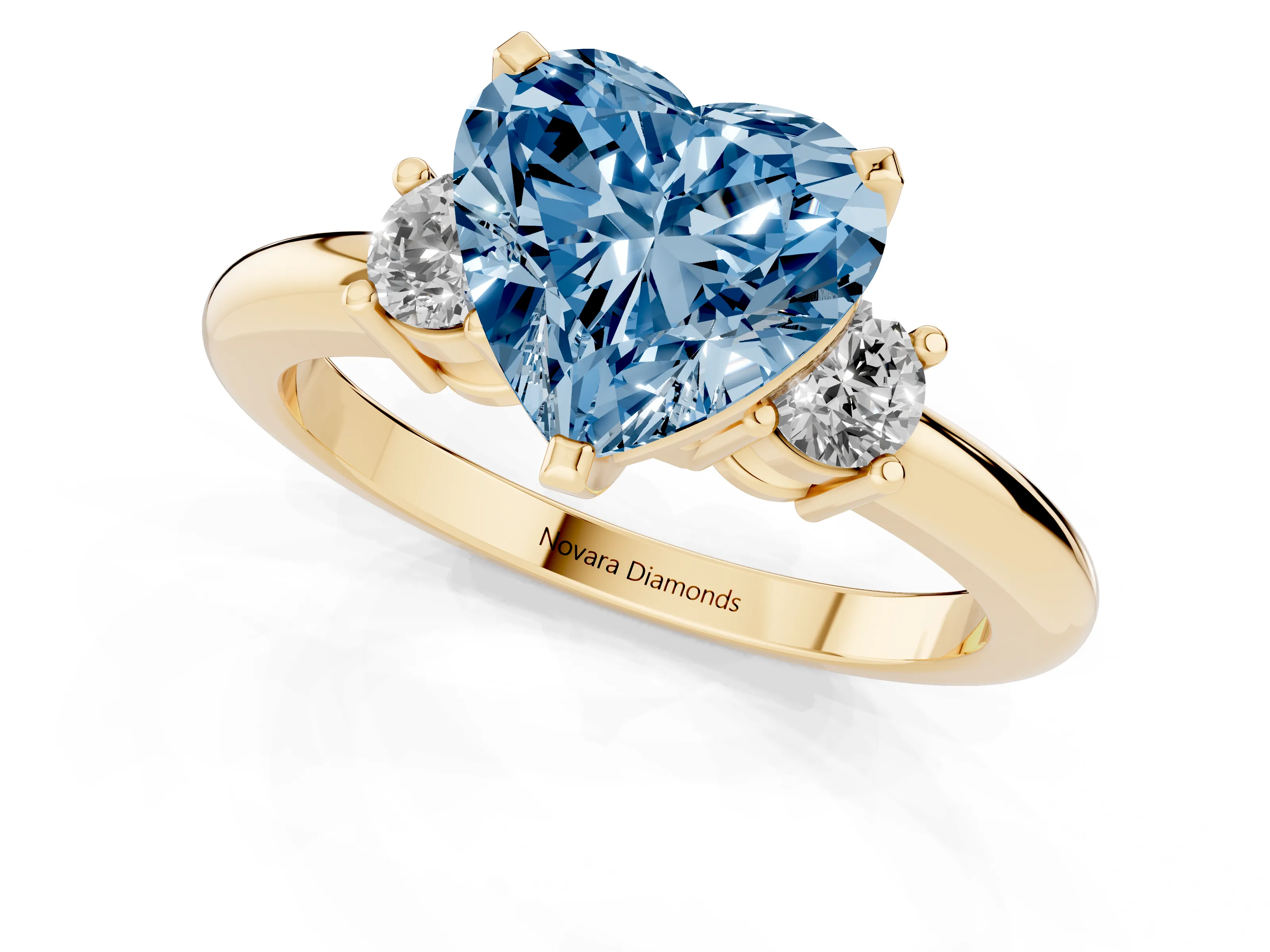 Fancy Blue Three-Stone Heart Cut Diamond Ring Set in Yellow gold with Prong Setting and Plain Band
