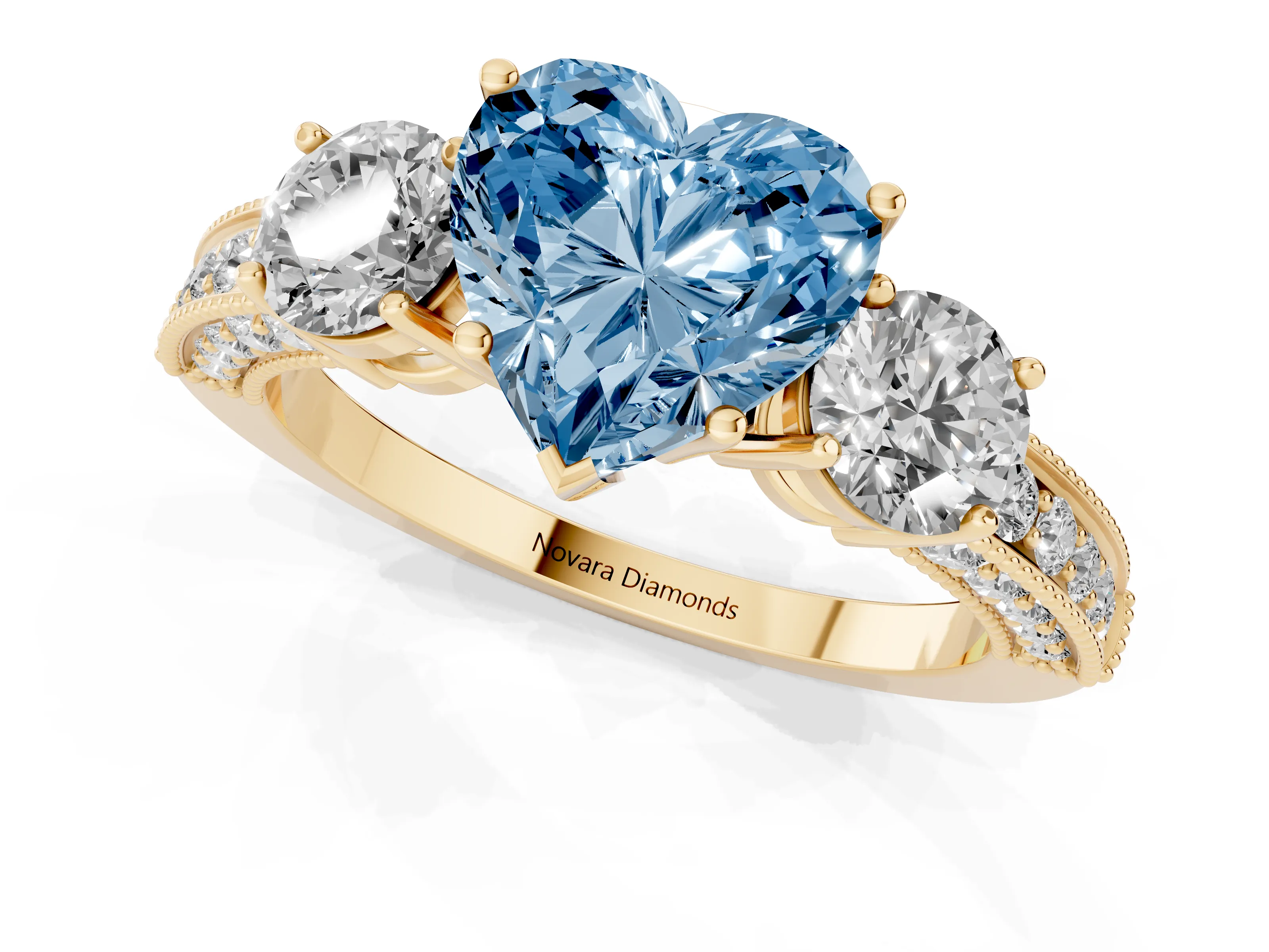 Fancy Blue Heart Cut Diamond Three-Stone Ring Set in Yellow gold with Round Side Stones and Pavé Band