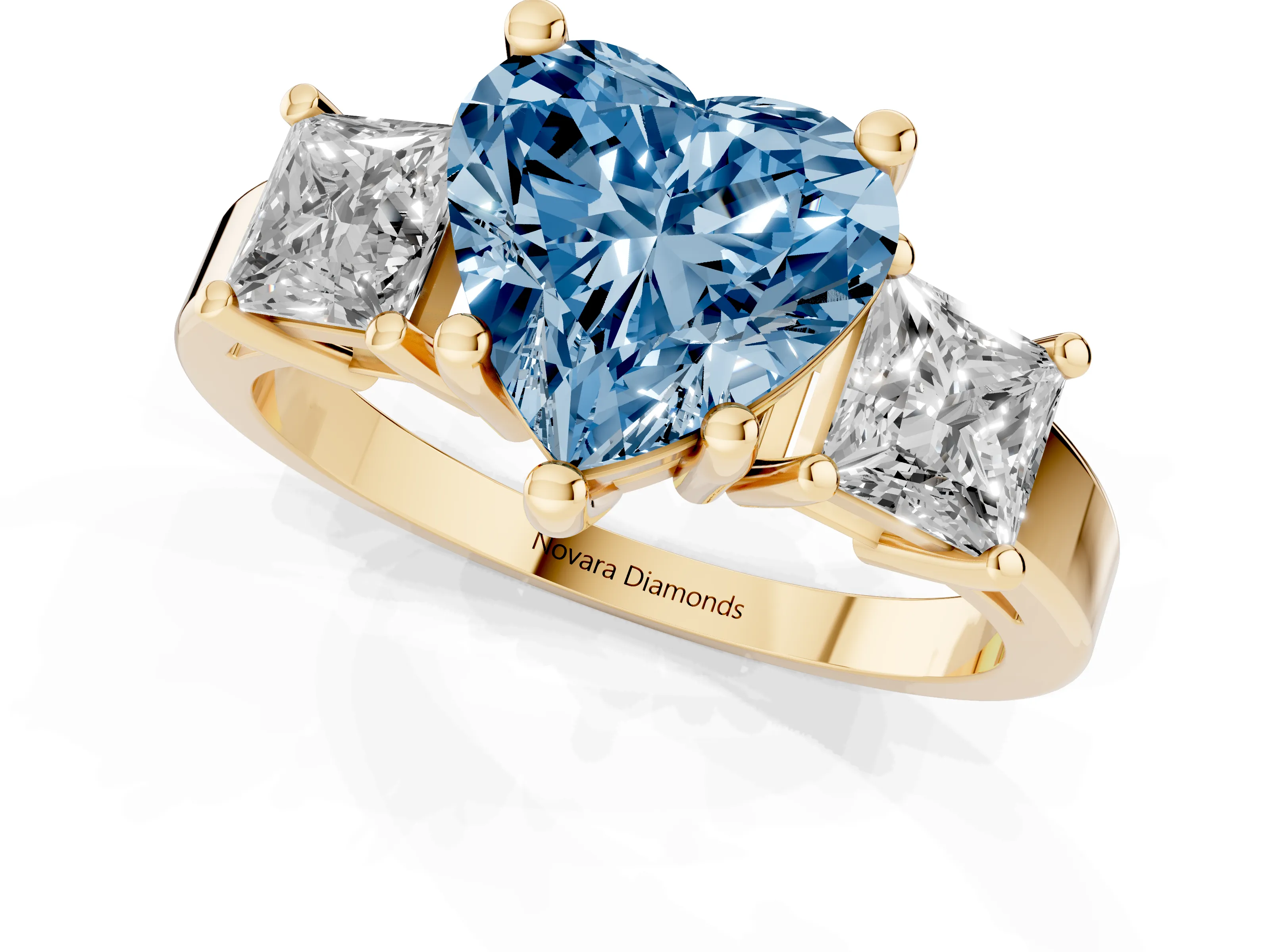 Fancy Blue Three-Stone Heart Cut Diamond Solitaire Ring Set in Yellow gold with Prong Setting