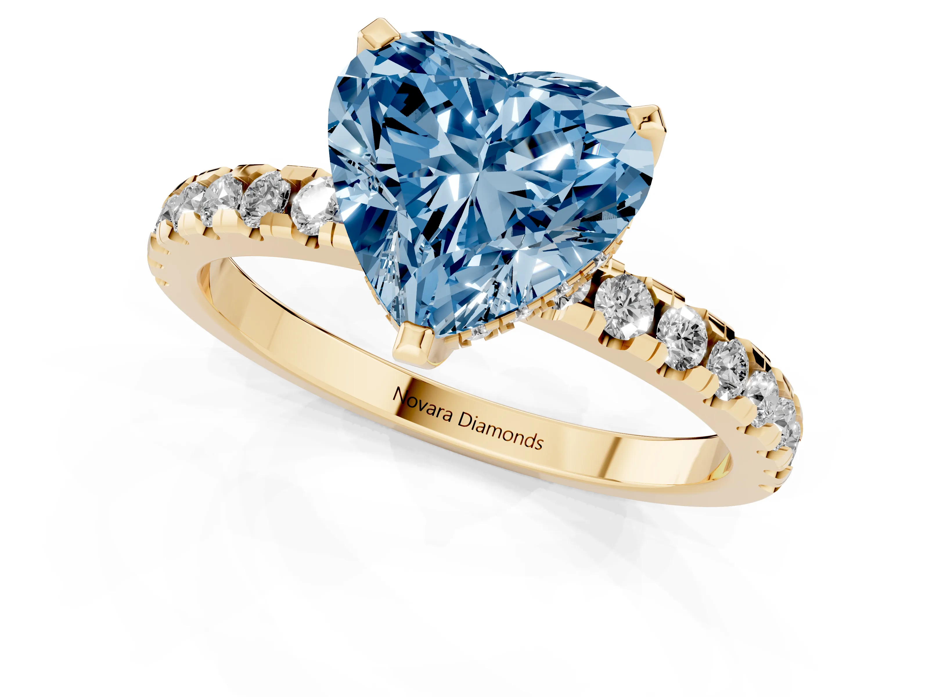 Fancy Blue Heart Cut Diamond Pavé Solitaire Ring Set in Yellow gold with Round Band Accents and Prong Setting