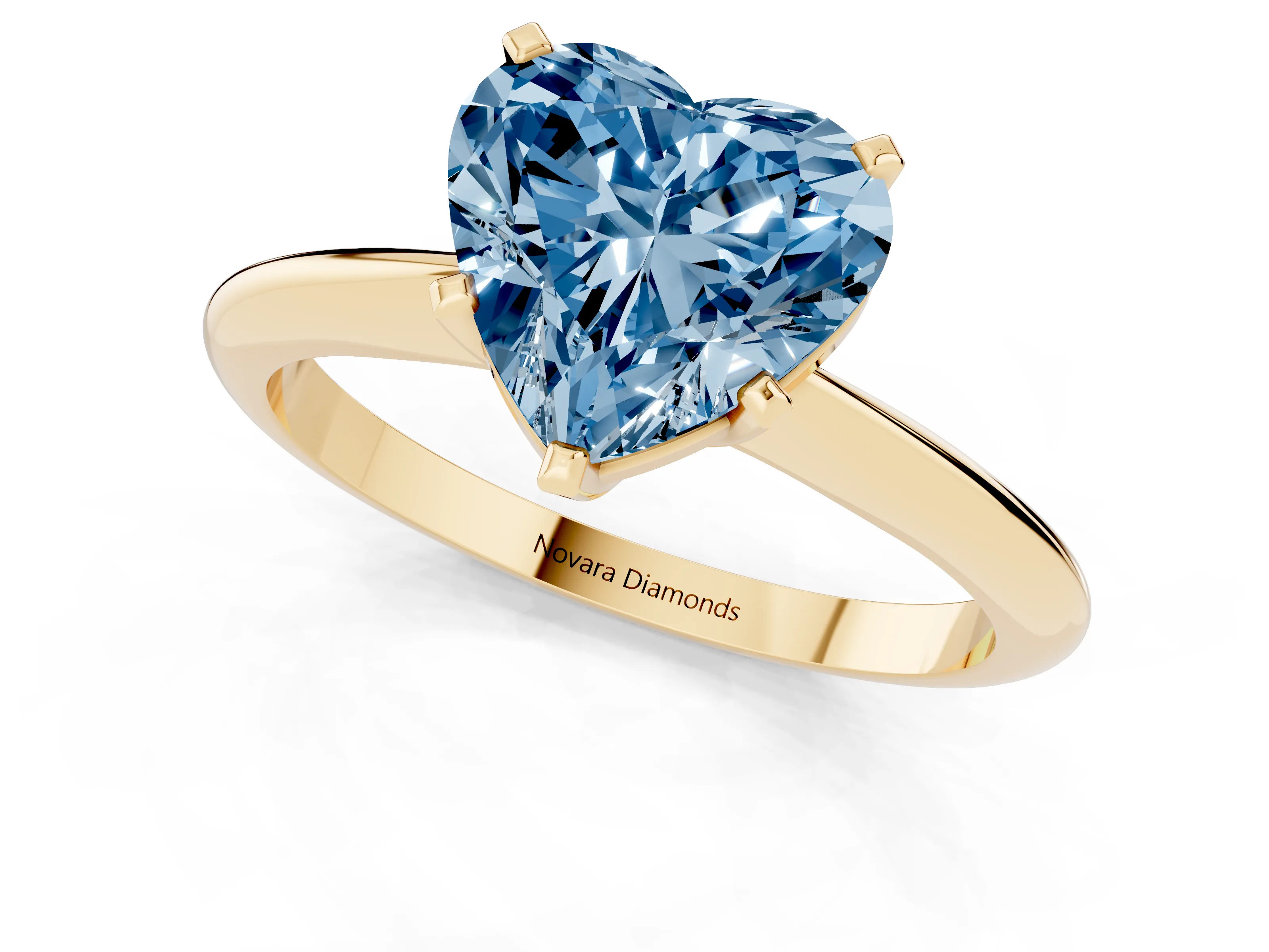 Fancy Blue Heart Cut Diamond Solitaire Ring Set in Yellow gold with Prong Setting on a Plain Round Band
