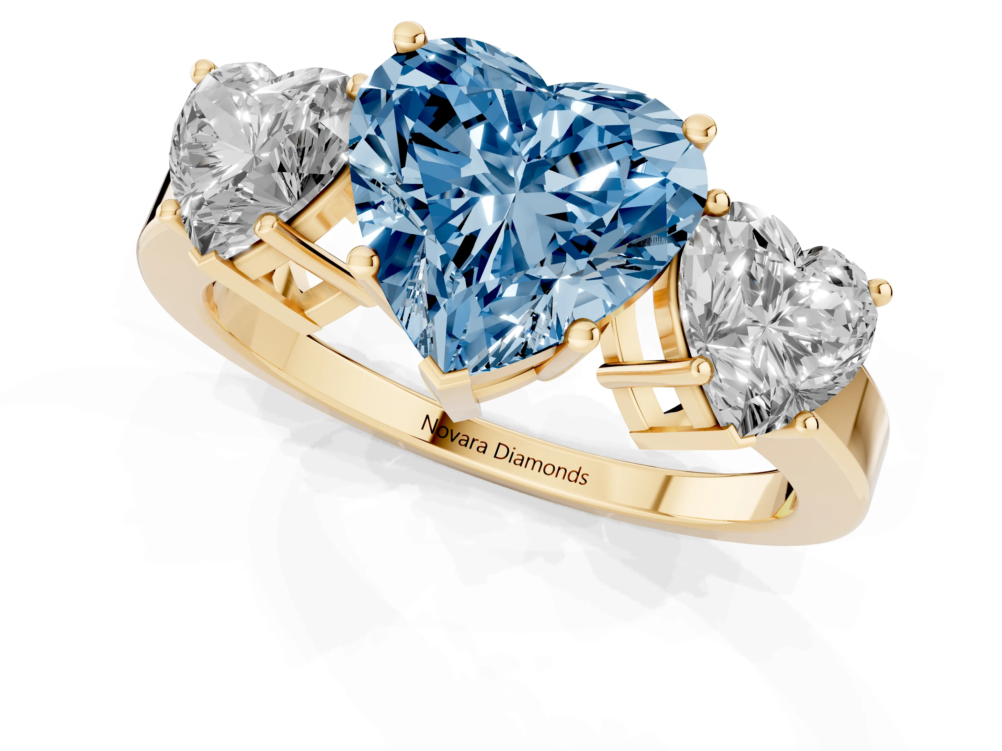 Fancy Blue Heart Cut Diamond Three-Stone Engagement Ring Set in Yellow gold with Flat Band