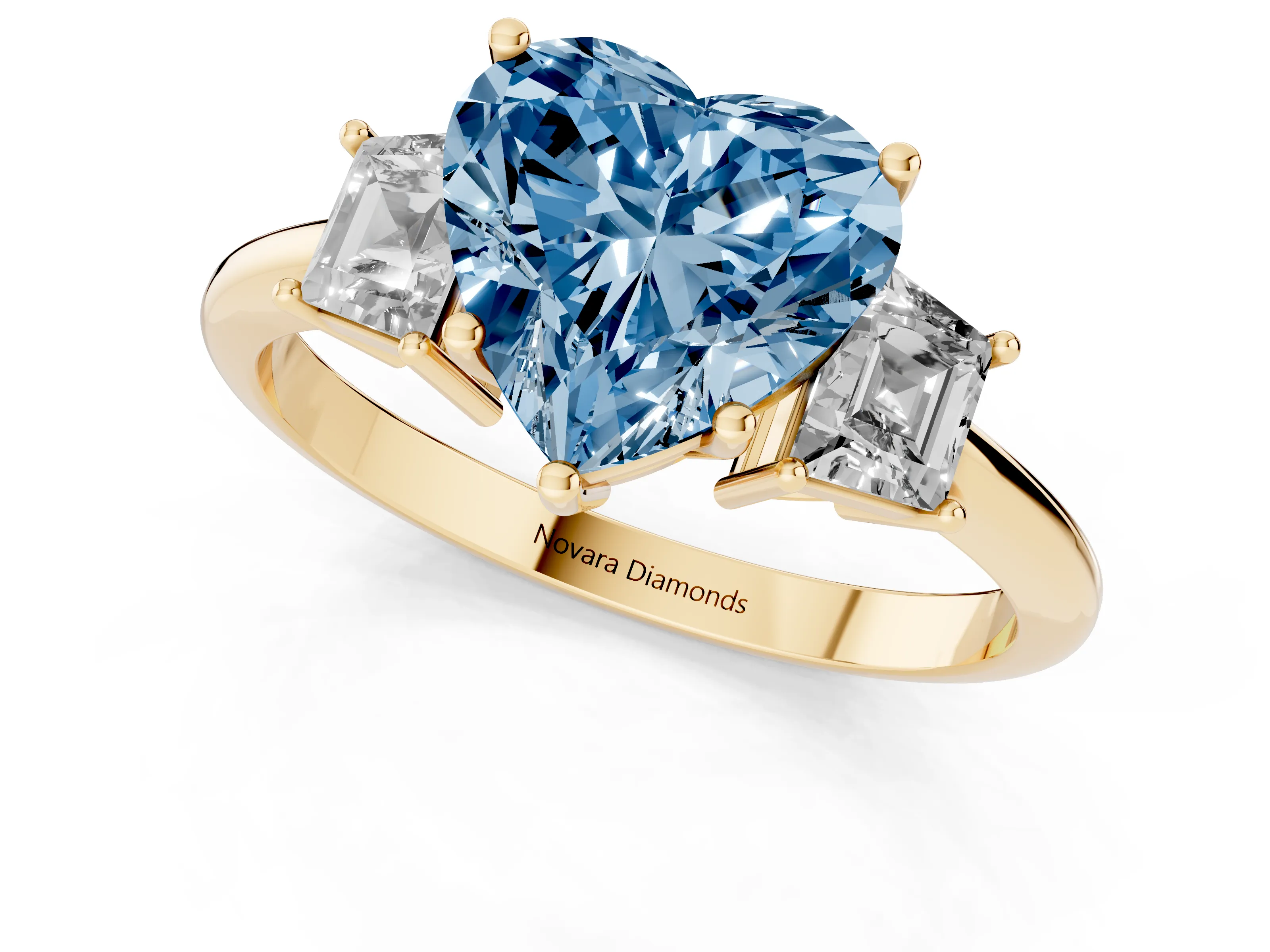 Fancy Blue Heart Cut Diamond Three-Stone Ring Set in Yellow gold with Trapezoid Side Stones and Prong Setting
